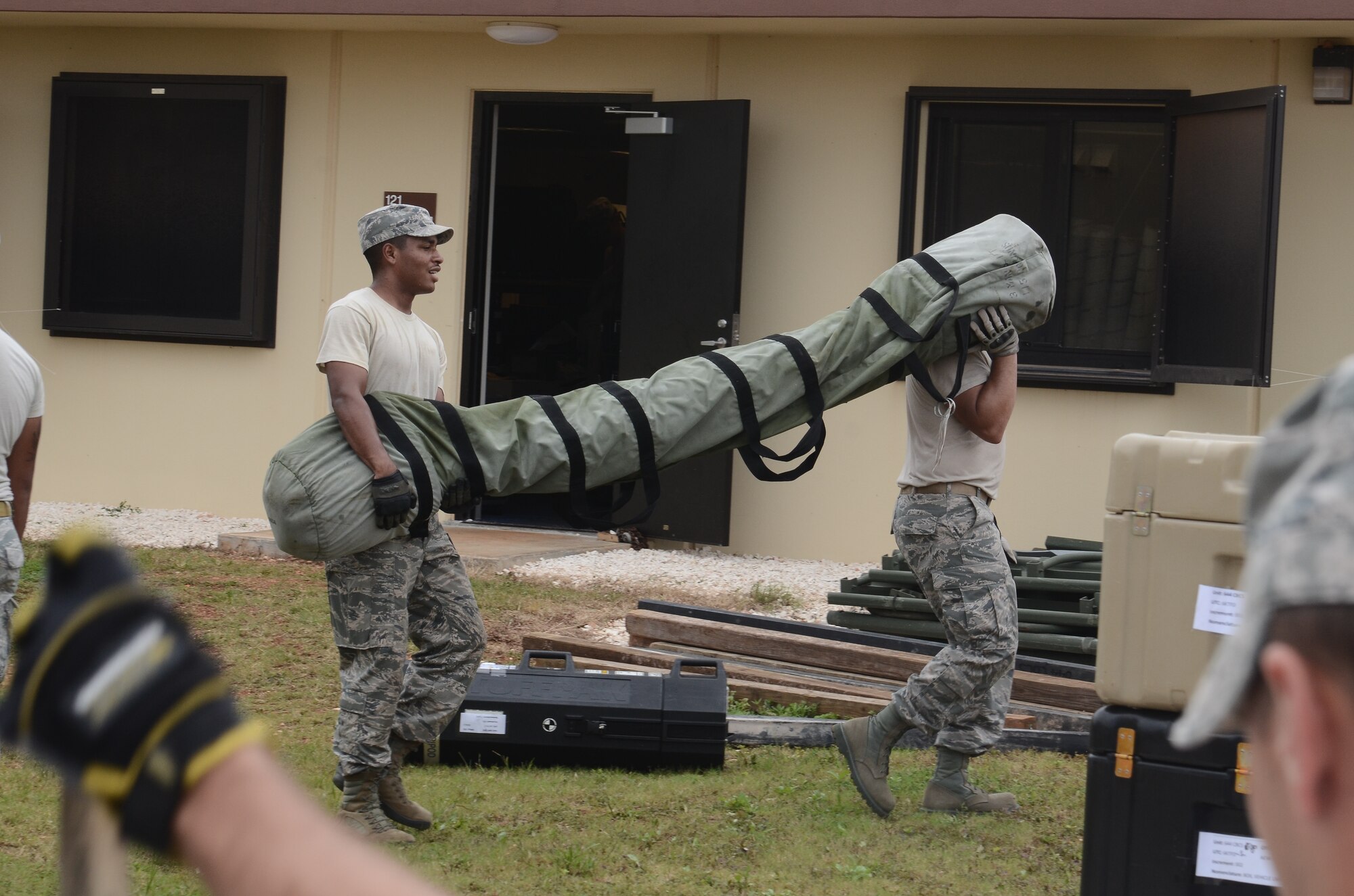Airmen from the 644th Combat Communications Squadron relocate equipment in preparation for Exercise Beverly Palms 13-05 on Andersen Air Force Base, Guam, Sept. 9, 2013. During the exercise, Andersen Airmen practiced their ability to react, defend and execute operations in a wartime scenario. (U.S. Air Force photo by Airman 1st Class Adarius Petty/Released)