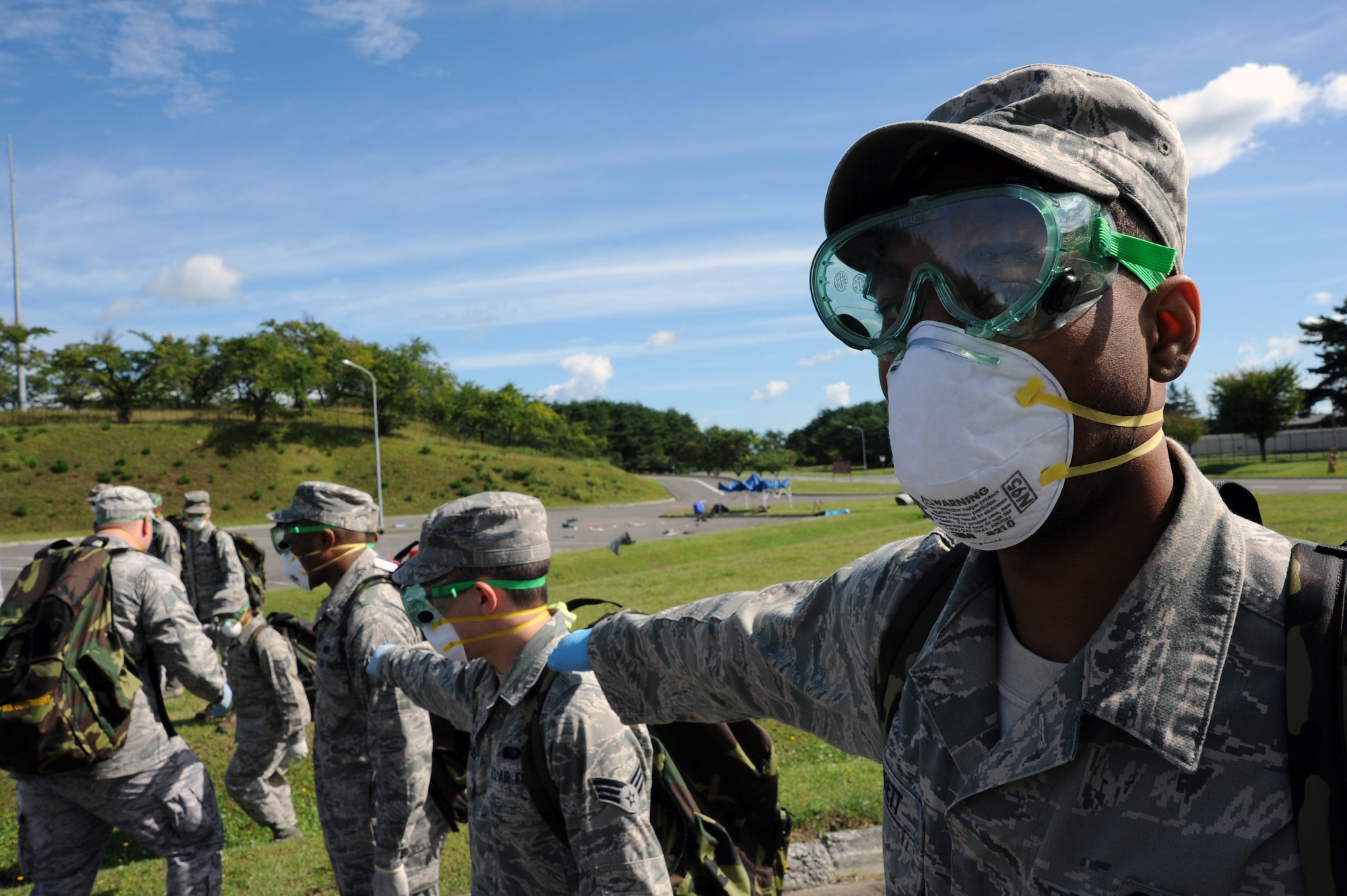 U.S. Air Force Staff Sgt. Dominique Barrett, 35th Force Support Squadron, aligns with a search and recovery team during a Major Accident Response Exercise at Misawa Air Base, Japan, Sept. 6, 2013. Airmen from the 35 FSS formed the team to respond to a simulated aircraft accident on the base’s north side. (U.S. Air Force photo by Senior Airman Derek VanHorn)