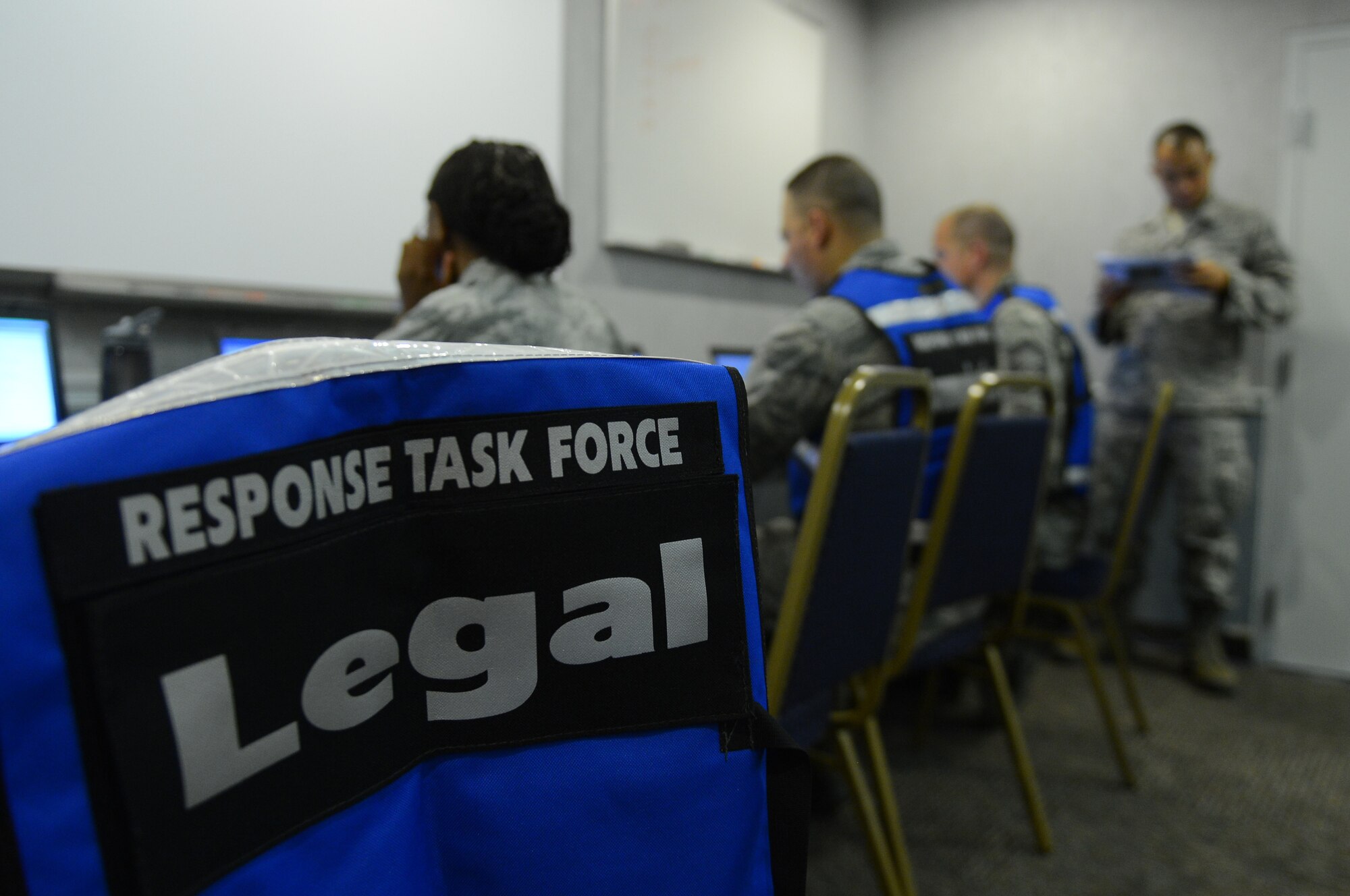 A vest rests on a chair at Hoban Hall during an exercise on Barksdale Air Force Base, La., Sept. 5, 2013. To help units and outside agencies effectively communicate certain personnel from various organizations wore the identifying vests.  (U.S. Air Force photo/Senior Airman Micaiah Anthony)
