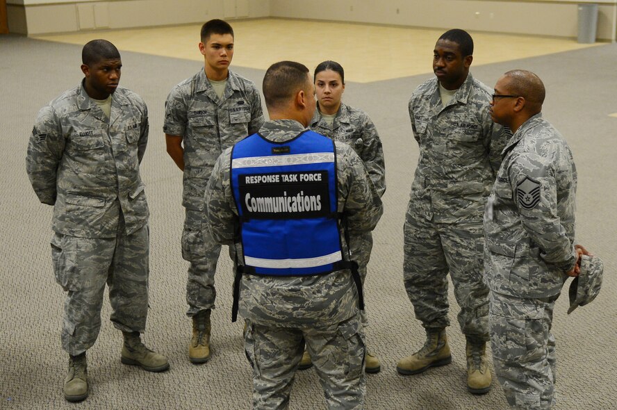 Lt. Col. Julio Gomez, center, 2nd Communications Squadron commander, briefs Airmen during an exercise at Hoban Hall on Barksdale Air Force Base, La., Sept. 5, 2013. The Airmen were instructed to ensure members of the Initial Response Force could communicate via radio, phones or email effectively. (U.S. Air Force photo/Senior Airman Micaiah Anthony)