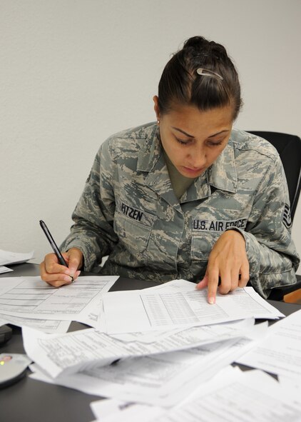 Staff Sgt. Christina Fitzen, 2nd Civil Engineer Squadron operations management, collects and records all the information involved with a simulated incident at Hoban Hall on Barksdale Air Force Base, La., Sept. 6, 2013. The information Fitzen collected was used to inform the Initial Response Force commander and the Response Task Force commander of some of the details involving the simulated incident. (U.S. Air Force photo/Senior Airman Joseph A. Pagán Jr.)