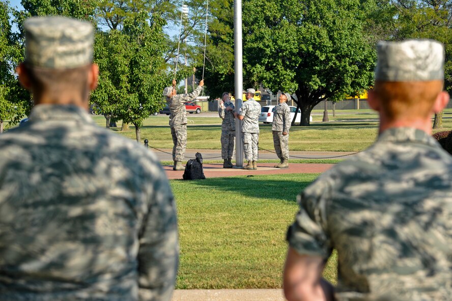 22nd Air Refueling Wing honor guard practice for a retreat ceremony Sept. 9, 2013, at McConnell Air Force Base, Kan. Retreat signifies the end of the official duty day and is conducted to pay respect to the U.S. flag. (U.S. Air Force photo/Airman 1st Class John Linzmeier)