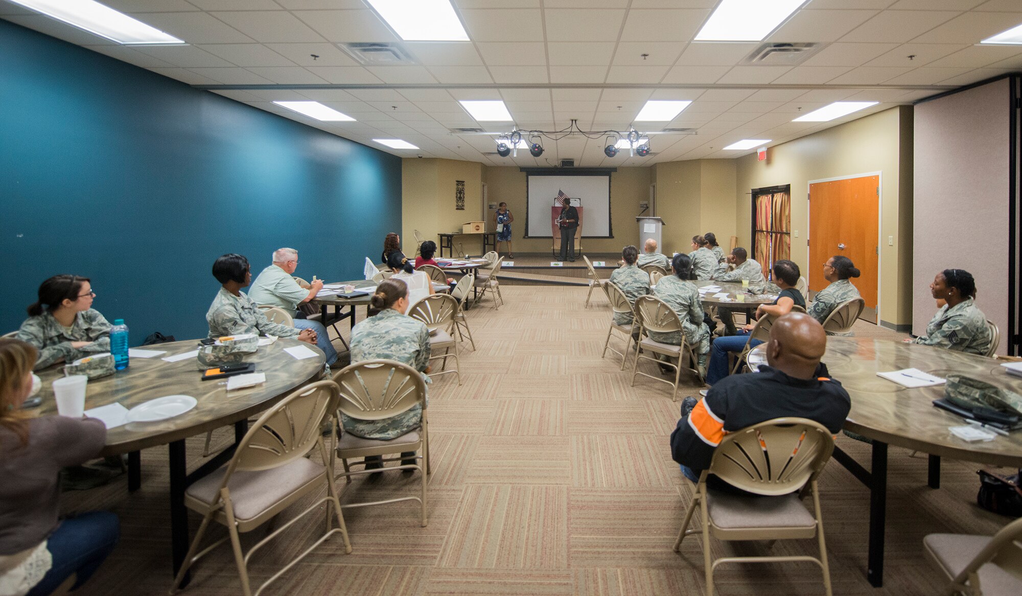 A small crowd of Toastmasters watch a Table Topics speech at The SPOT, Moody Air Force Base, Ga., Sept. 8, 2013. During Table Topics, guests are selected at random to practice giving improvised speeches to a crowd of toastmasters for at least one minute. (U.S. Air Force photo by Airman 1st Class Ryan Callaghan/Released)
