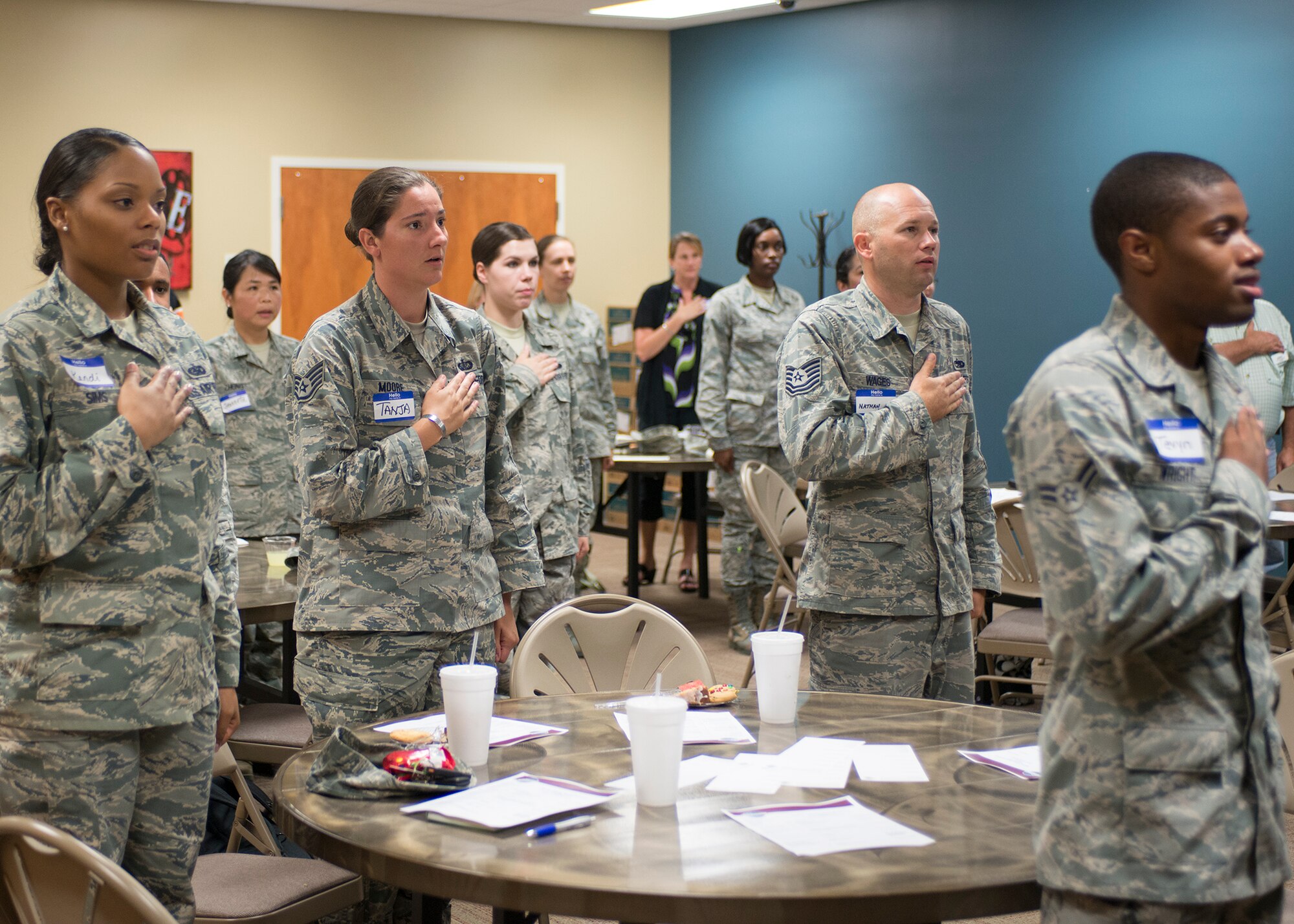 Members and guests of the Moody Talking Tigers Toastmasters club recite the Pledge of Allegiance at The SPOT, Moody Air Force Base, Ga., Sept. 8, 2013. Toastmasters are a group committed to developing communication and leadership skills. (U.S. Air Force photo by Airman 1st Class Ryan Callaghan/Released)