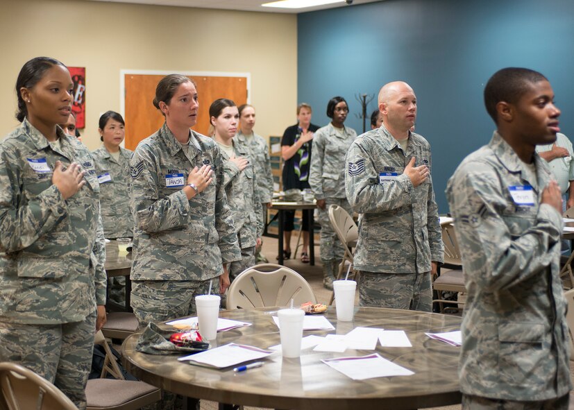 Members and guests of the Moody Talking Tigers Toastmasters club recite the Pledge of Allegiance at The SPOT, Moody Air Force Base, Ga., Sept. 8, 2013. Toastmasters are a group committed to developing communication and leadership skills. (U.S. Air Force photo by Airman 1st Class Ryan Callaghan/Released)