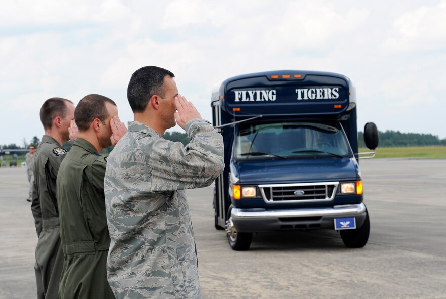 U.S. Air Force Col. Steven Gregg, 347th Rescue Group commander, and members of the 71st Rescue Squadron salute as U.S. Rep. Jack Kingston’s vehicle comes to a halt at Moody Air Force Base, Ga., Sept. 6, 2013. Gregg and members of the 71st RQS showed Kingston all the features and many upgrades of the HC-130J Combat King II. (U.S. Air Force photo by Airman 1st Class Olivia Bumpers/Released)