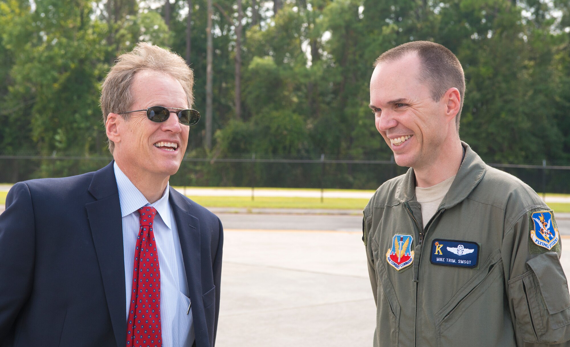 U.S. Rep. Jack Kingston and U.S. Air Force Senior Master Sgt. Mike Trim, 71st Rescue Squadron senior enlisted manager, share a laugh after touring the HC-130J Combat King II at Moody Air Force Base, Ga., Sept. 6, 2013. The HC-130J is currently scheduled for its first flight in October. (U.S. Air Force photo by Airman 1st Class Ryan Callaghan/Released)
