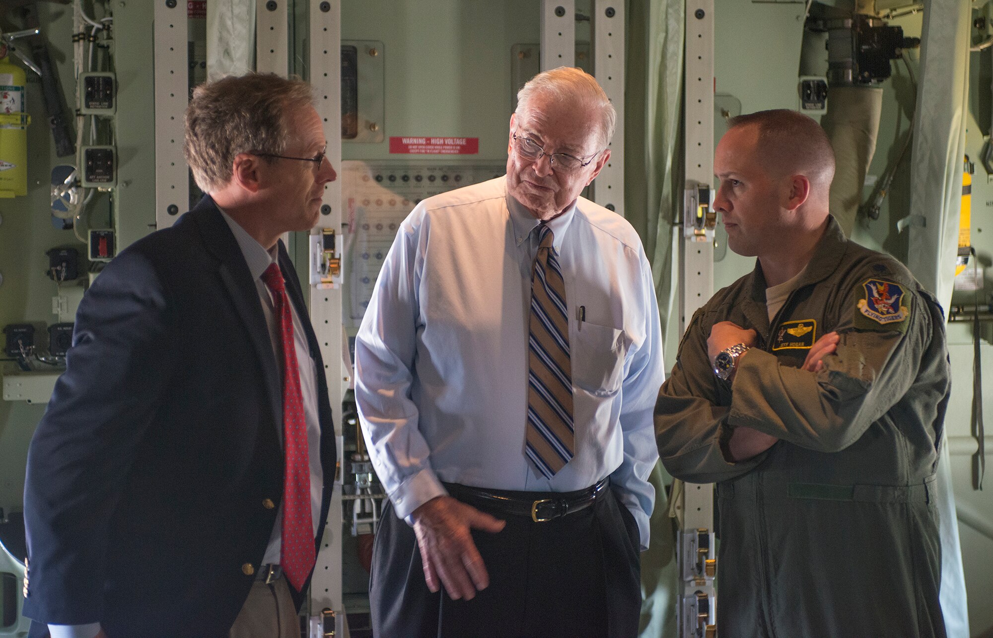U.S. Rep. Jack Kingston, left, speaks with Parker Green, Moody Support Committee chairman, and U.S. Air Force Lt. Col. Jeff Hogan, 23d Wing director of staff, in the cargo compartment of Moody’s first HC-130J Combat King II at Moody Air Force Base, Ga., Sept. 6, 2013. HC-130J aircrew members demonstrated the flip-floor rollers used for moving cargo pallets. (U.S. Air Force photo by Airman 1st Class Ryan Callaghan/Released)

