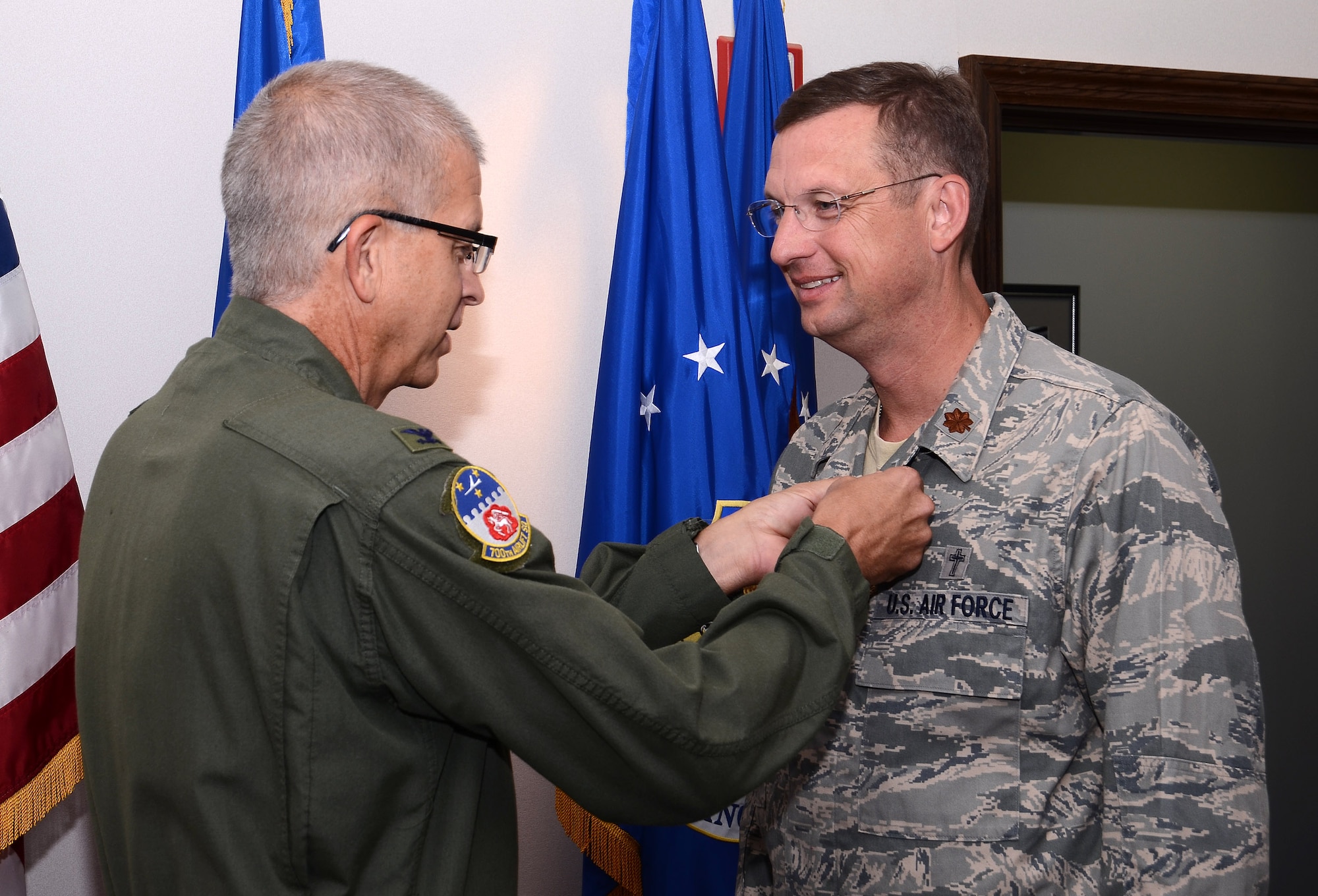 Col. Tim Tarchick, 94th Airlift Wing commander, presents Chaplain (Maj.) Douglas A. Collins with the Meritorious Service Medal, First Oak Leaf Cluster Sept.8 for outstanding professional skill, leadership and ceaseless efforts to support the Airmen and families of the 94th Airlift Wing during his Sept. 9, 2005 to Jan. 2013 tenure.