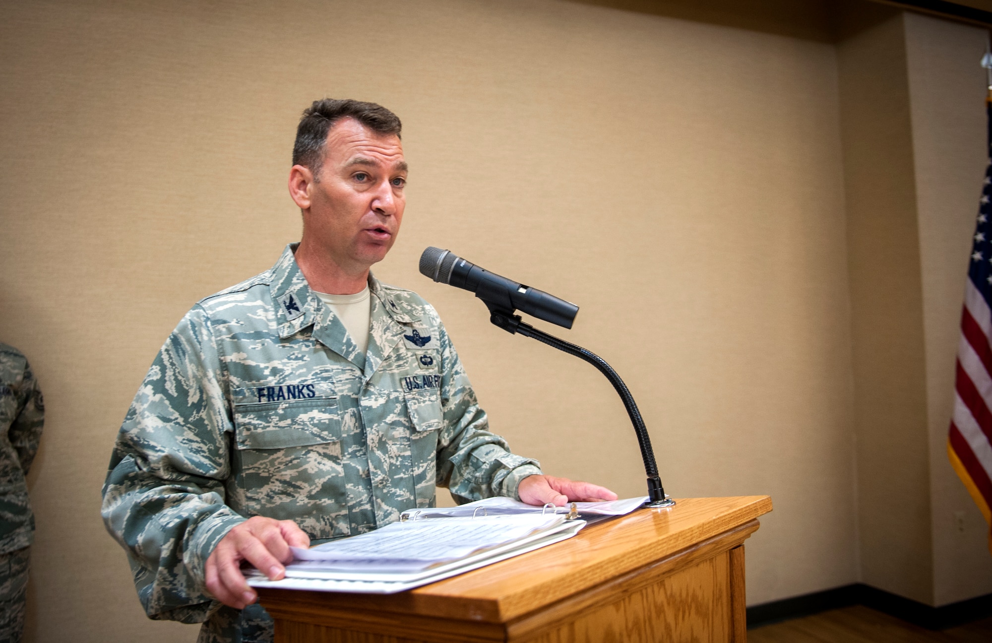 U.S. Air Force Col. Chad Franks, 23d Wing commander, gives a speech during the 23d Medical Group assumption of command ceremony at Moody Air Force Base, Ga., Sept. 6, 2013. Col. Paul Gardetto assumed command of the 23d MDG after Col. Alvis Headen III retired Aug. 9. (U.S. Air Force photo by Senior Airman Jarrod Grammel/Released)
