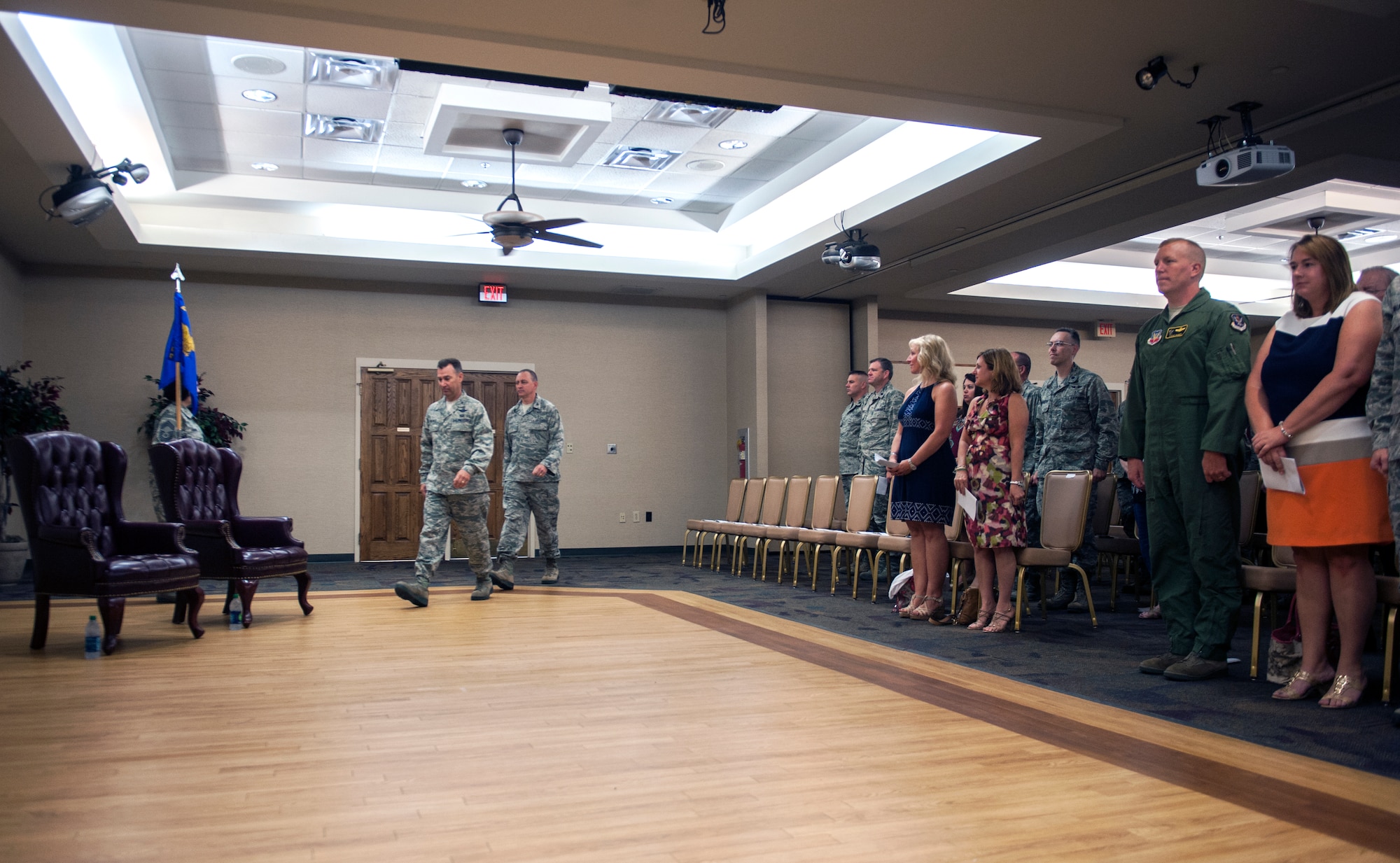 Airmen and families stand for the arrival of the official party during the 23d Medical Group assumption of command ceremony at Moody Air Force Base, Ga., Sept. 6, 2013. U.S. Air Force Col. Chad Franks, 23d Wing commander, presided over the ceremony, which can be traced back to the time of Roman legions. (U.S. Air Force photo by Senior Airman Jarrod Grammel/Released)
