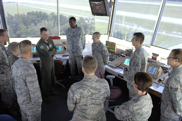 U.S. Air Force Maj. Gen. Jake Polumbo, 9th Air Force commander, talks with Airmen in the air traffic control tower at Seymour Johnson Air Force Base, N.C., Aug. 22, 2013.  Polumbo spent the day touring different facilities and sharing his leadership philosophies with 4th Fighter Wing Airmen.  (U.S. Air Force photo by Airman 1st Class Brittain Crolley)