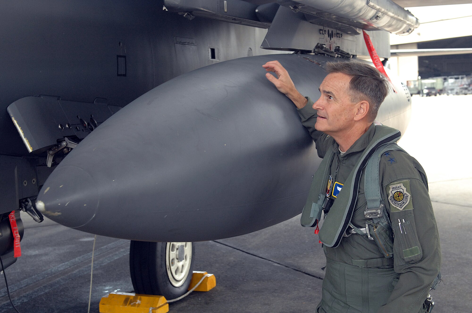 U.S. Air Force Maj. Gen. Jake Polumbo, 9th Air Force commander, performs an acceptance inspection on an F-15E Strike Eagle before his flight at Seymour Johnson Air Force Base, N.C., Aug. 22, 2013. Polumbo’s visit to the base marks his first since taking command of the 9th Air Force.  (U.S. Air Force photo by Airman 1st Class Brittain Crolley/Released)