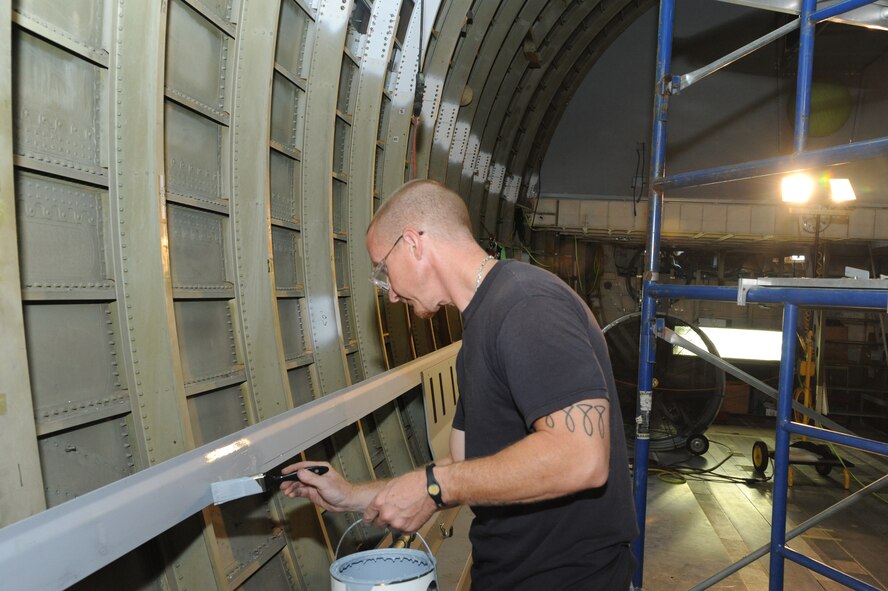 Ricky Frantz, 902nd Mission Support Group Trainer Development Division sheet metal mechanic and painter, paints the interior of what will be a C-17 Aeromedical Trainer Aug. 19 at Joint Base San Antonio-Randolph.  (U.S. Air Force photo by Rich McFadden/released) 