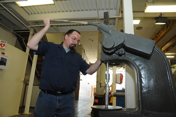 Edmund DuPont, 902nd Mission Support Group Trainer Development Division machinist, duplicates a part needed for a C-17 Aeromedical Trainer project Aug. 19 at Joint Base San Antonio-Randolph.  (U.S. Air Force photo by Rich McFadden/released)