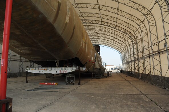The exterior of a C-17 aircraft is being modified by the 902nd Mission Support Group Trainer Development Division, as an Aeromedical Trainer Aug. 19 at Joint Base San Antonio-Randolph. (U.S. Air Force photo by Rich McFadden/released)