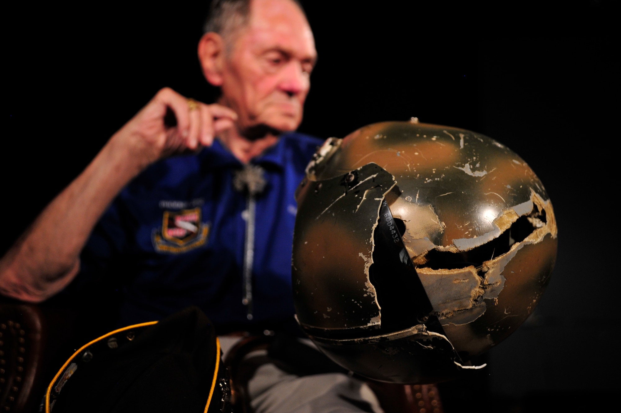 Retired Lt. Col. Richard E. French, a former U.S. Air Force fighter pilot, recounts a time
in his career when he was wounded during an interview at Nellis Air Force Base, Nev.,
Aug. 20. His most serious injury was during Vietnam when he was struck by ground fire
that split his helmet down the center. He received nine stitches to his head and returned to flying operations the following day. He was awarded the Purple Heart. (U.S. Air Force photo by Staff Sgt. N.B.)