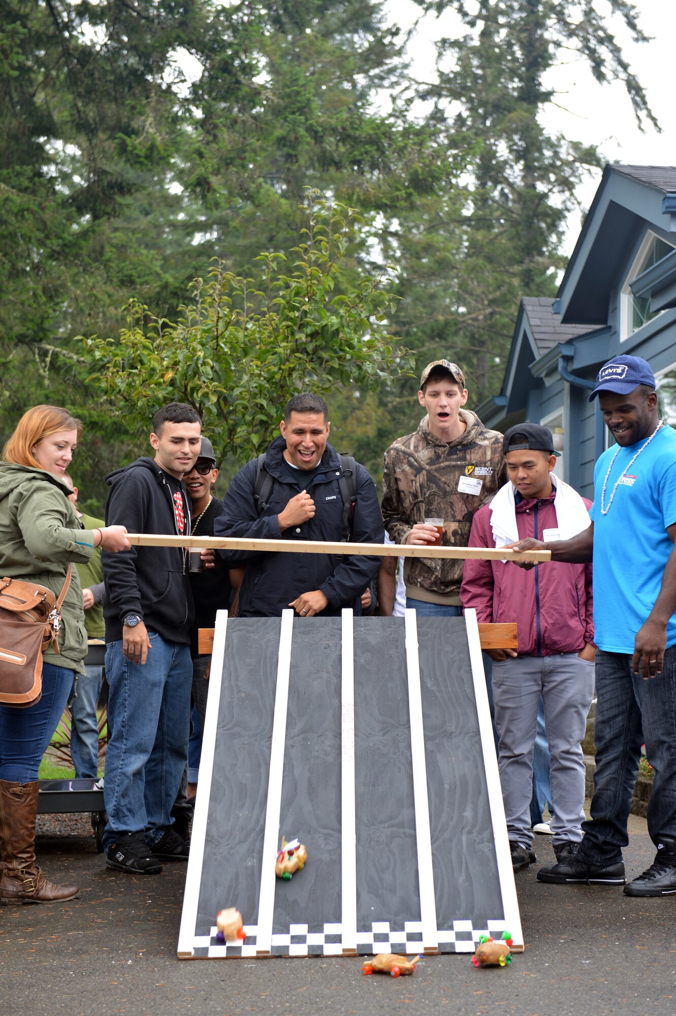 Honored guests of this year’s Foof-a-raw, race hand-made potato cars down a ramp, Sept. 6, 2013 at Olympia, Wash.  Each yacht was given a raw potato, nails, and make-shift wheels, during their boat ride to the event, to make a team car. (U.S. Air Force photo/Staff Sgt. Jason Truskowski) 