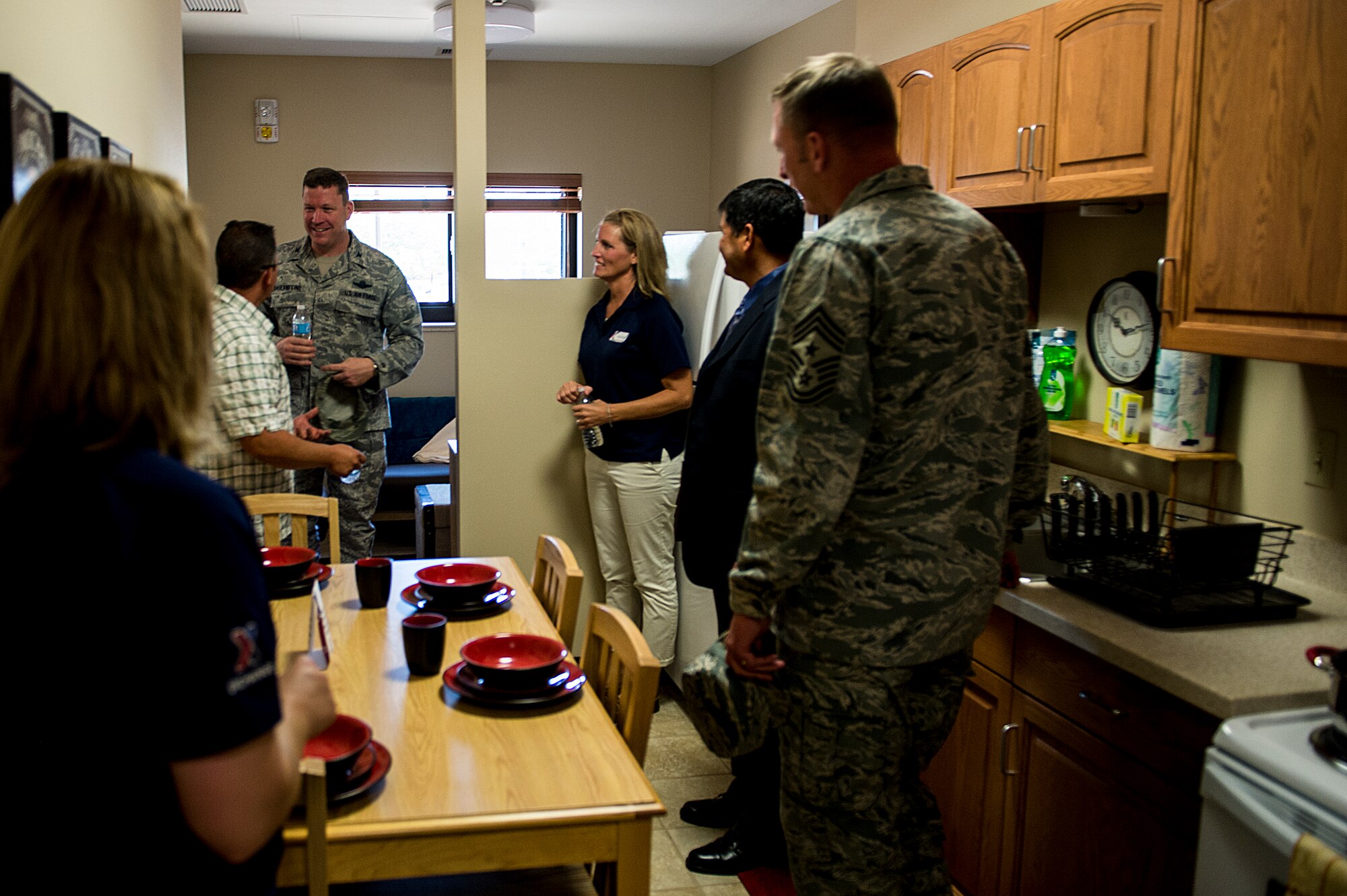U.S. Air Force Col. Tony Bauernfeind, 27th Special Operations Wing commander, and Chief Master Sgt. Paul Henderson, 27 SOW command chief, tour a dorm room after a ribbon-cutting ceremony Sept. 6 at Cannon Air Force Base, N.M. The $12.4 million construction project was initiated in April 2012 and is based on the Air Force's Dorms-4-Airmen concept. The building boasts 96 individual rooms, each with its own private bathroom. (U.S. Air Force photo/Staff Sgt. Matthew Plew)