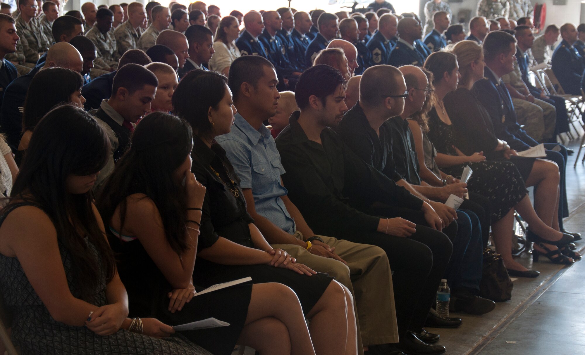 130906-F-GZ967-005 The family of Senior Airman Michael Gnoato remembers his life during a memorial service Sept. 6, 2013, in the Peacekeeper High Bay, F.E. Warren Air Force Base, Wyo. (U.S. Air Force photo by Airman 1st Class Brandon Valle)