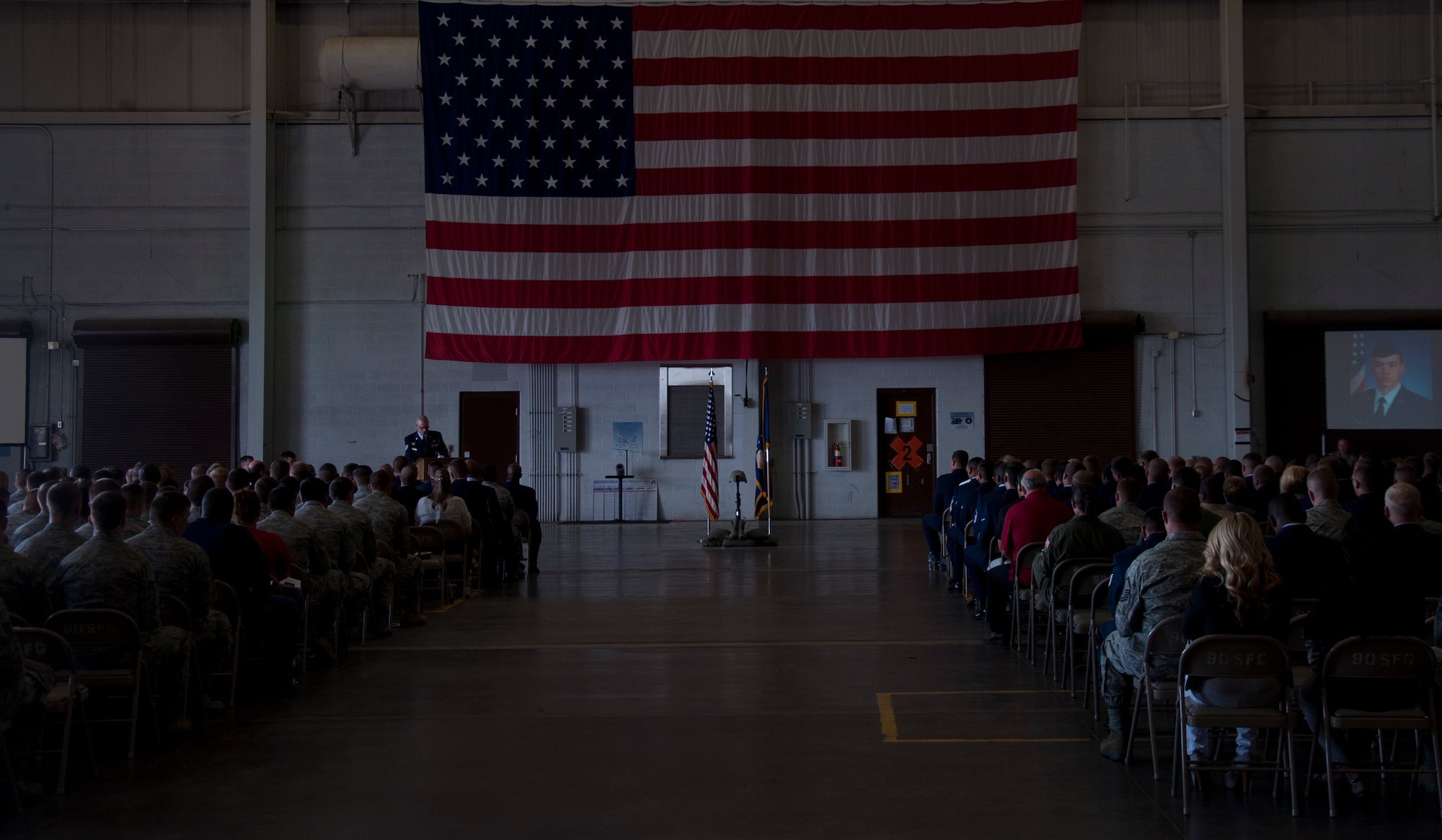 130906-F-GZ967-003 Members of the 90th Missile Wing attend a memorial service for Senior Airman Michael Gnoato Sept. 6, 3013, in the Peacekeeper High Bay, F.E. Warren Air Force Base, Wyo. (U.S. Air Force photo by Airman 1st Class Brandon Valle)