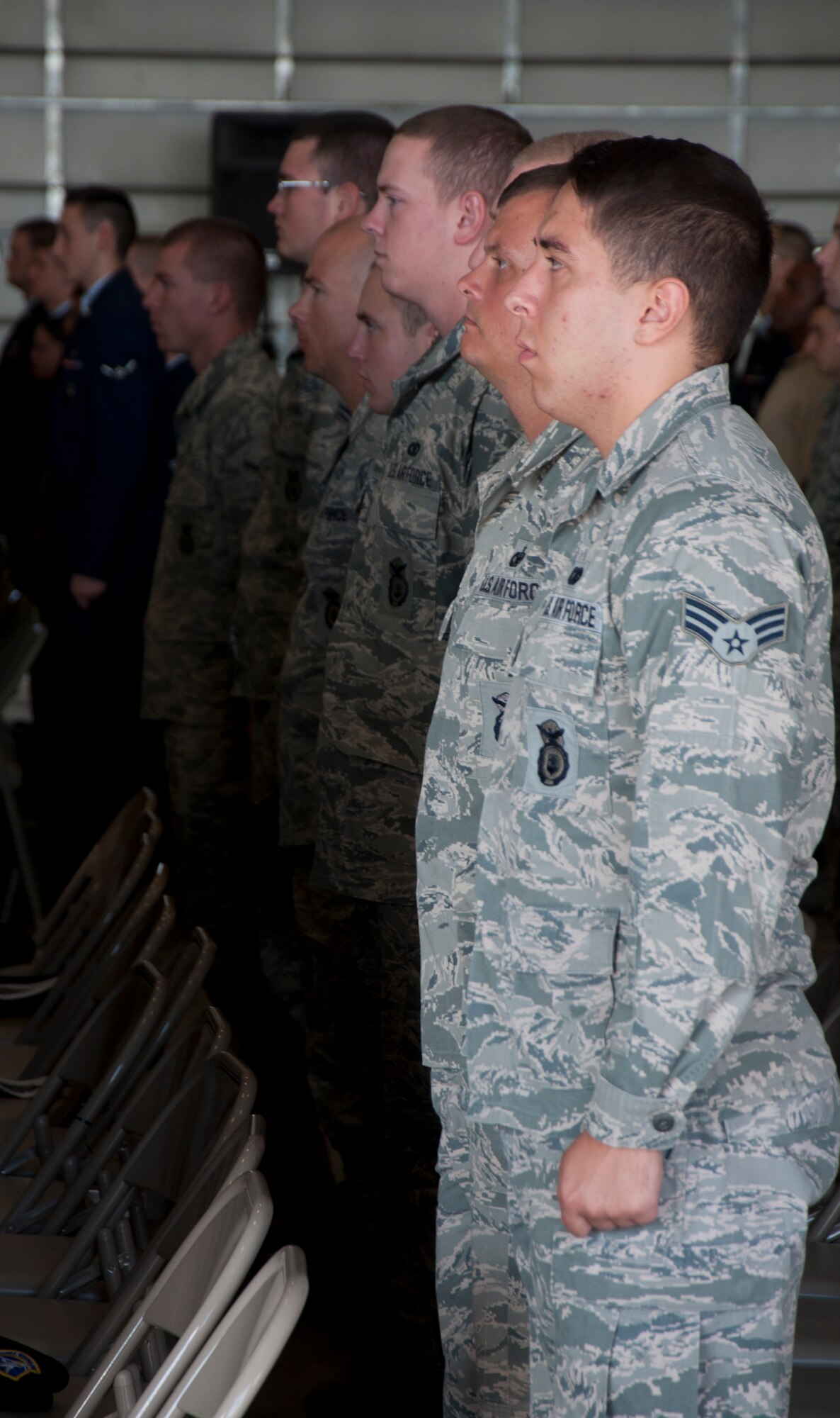 130906-F-GZ967-002 Members of the 90th Missile Security Forces Squadron stand at attention during the final roll call during a memorial service for Senior Airman Michael Gnoato. Final roll call is a memorial to fallen soldiers signifying a final good-bye from their unit. (U.S. Air Force photo by Airman 1st Class Brandon Valle)