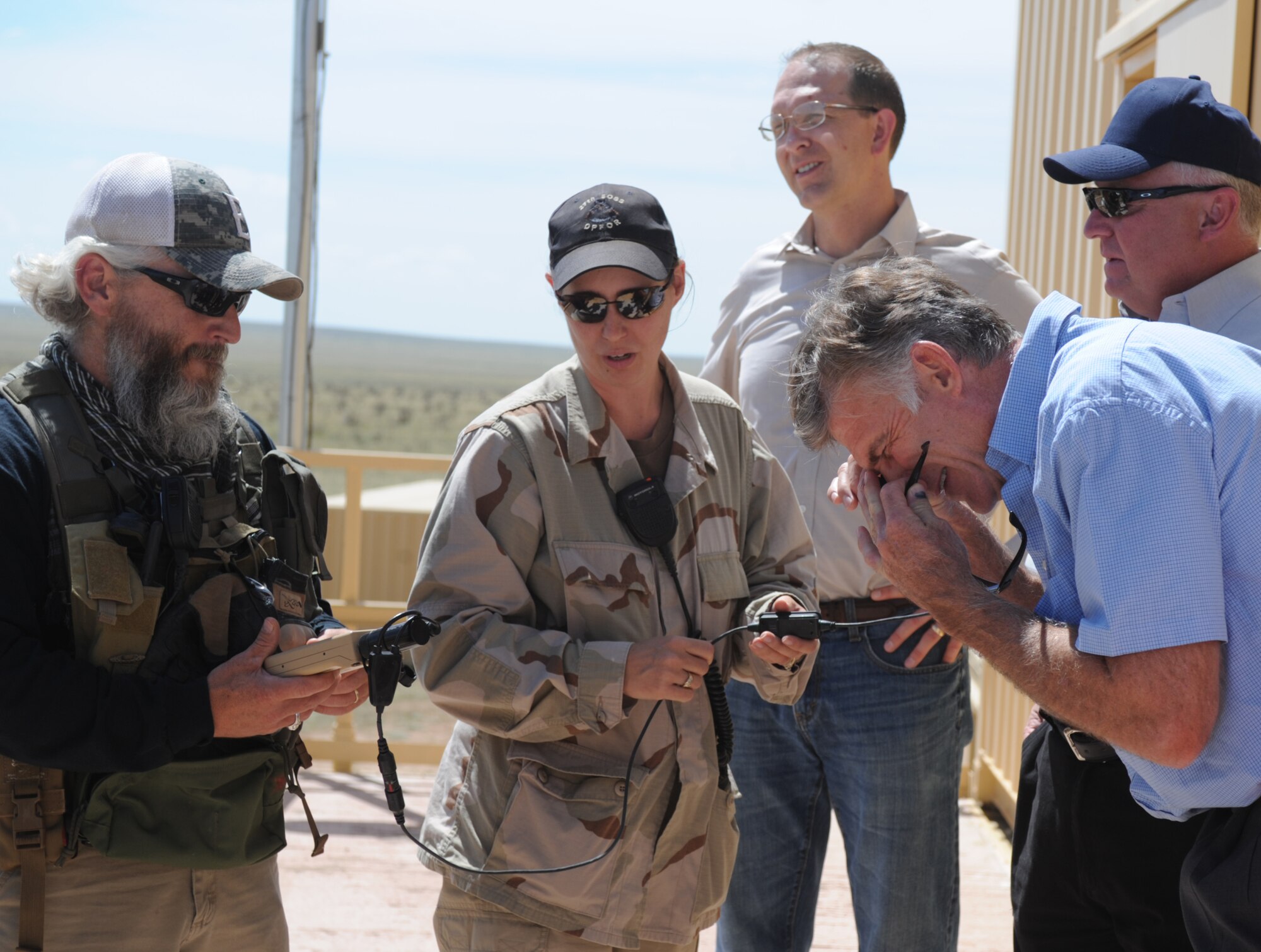 Personnel at Melrose Air Force Range, N.M., demonstrate some of their equipment to honorary commanders as part of a tour Aug. 29, 2013 at Cannon Air Force Base, N.M. The 27th Special Operations Wing Honorary Commander Program serves as a critical link between local and military leaders. (U.S. Air Force photo/Senior Airman Ericka Engblom)