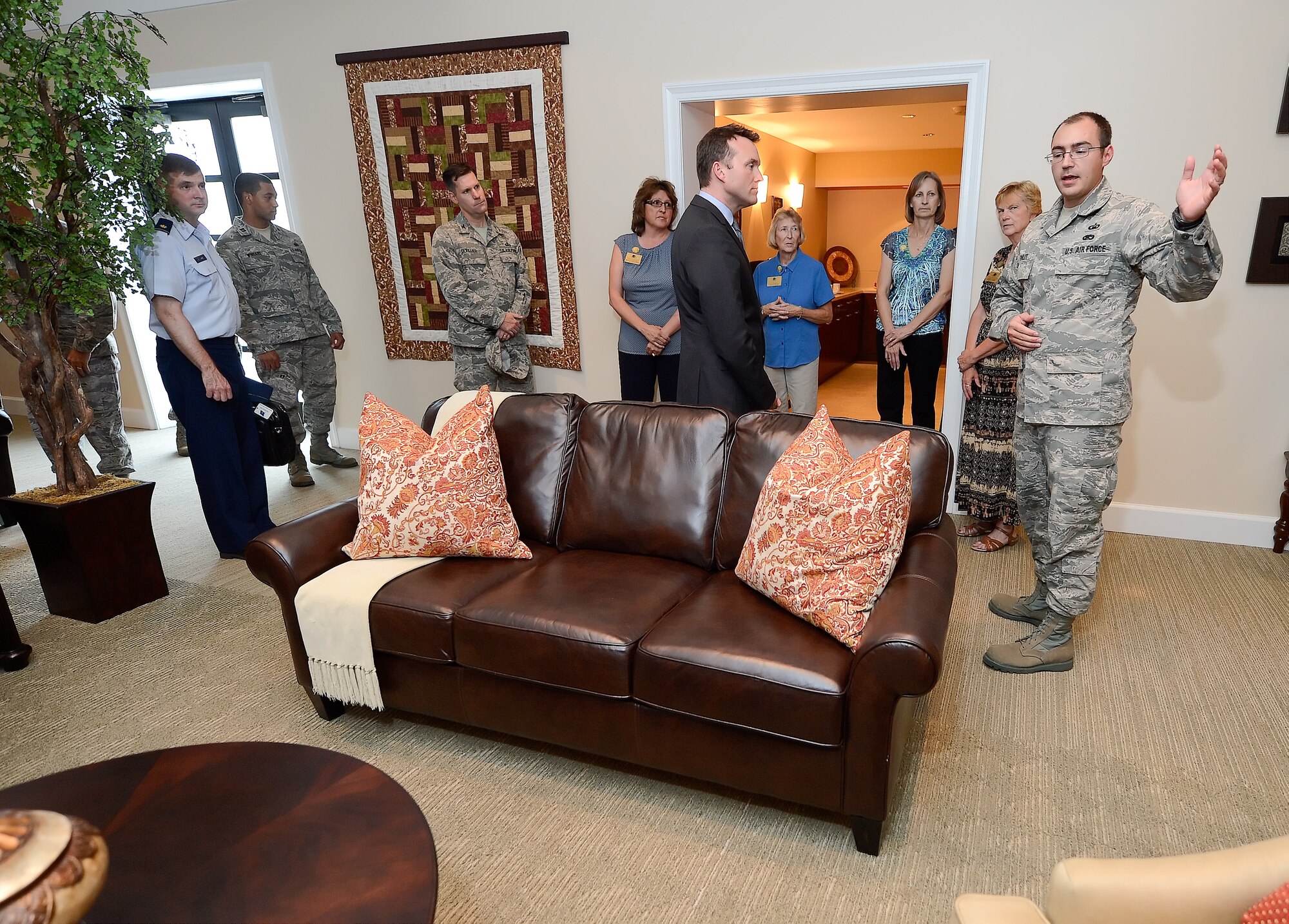 Technical Sgt. Sean Finley (right) briefs Acting Secretary of the Air Force Eric K. Fanning during a Campus for the Families of the Fallen tour at Dover Air Force Base, Del. on Sept. 5, 2013. Fanning toured Team Dover to review aircraft, mission systems, simulators and Air Force Mortuary Affairs Operations. (U.S. Air Force photo/Greg L. Davis)