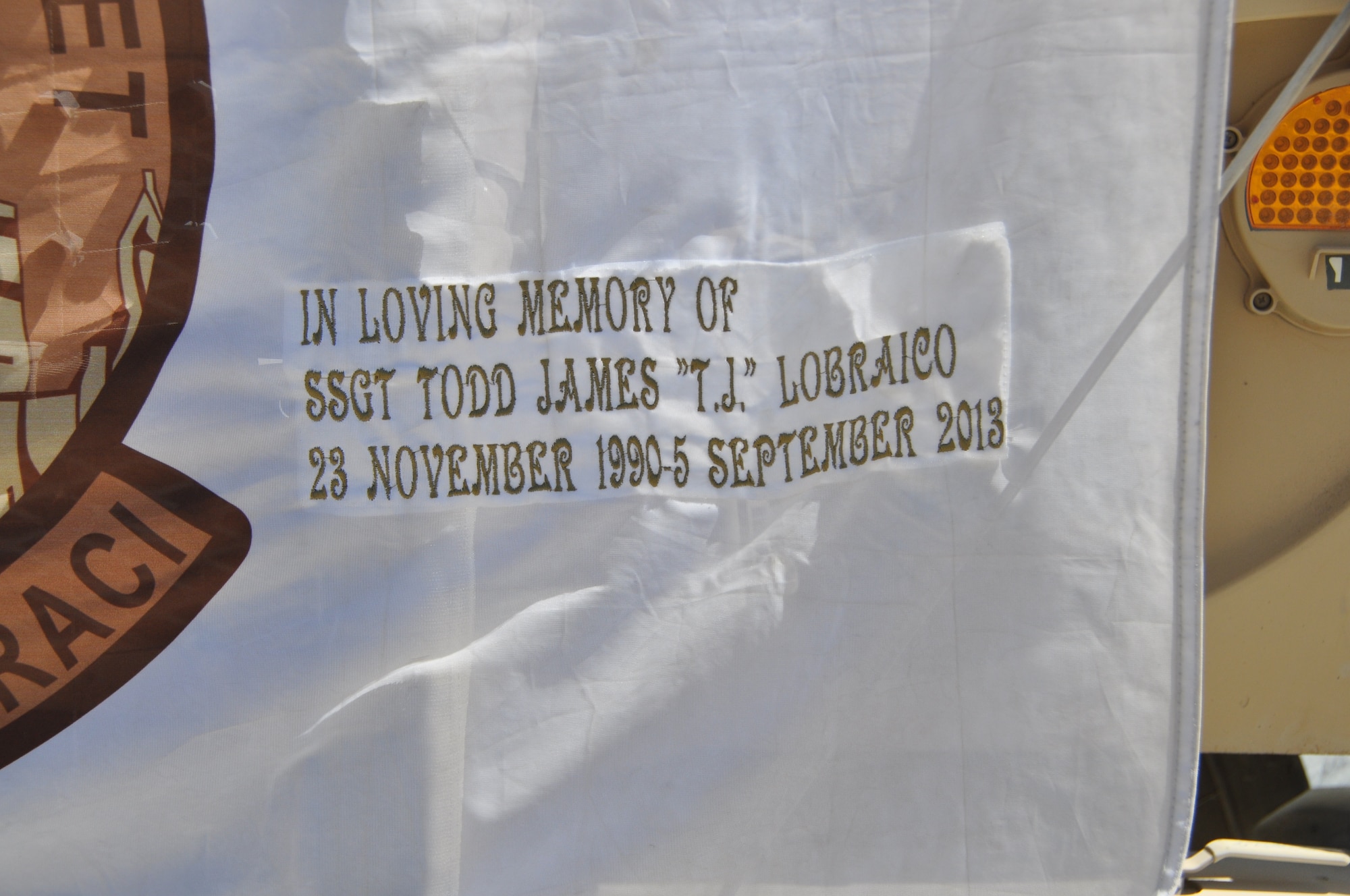 Sept. 11 is never too far from the hearts and minds of the 105th Security Forces Squadron deployed here from Stewart Air National Guard Base in Newburgh, New York. Through each other and mementos, they remember one unit member who was killed during the attacks of Sept. 11, 2001. During the writing of this article, the 105th SFS lost another security forces member, Staff Sgt. Todd ‘T.J.’ Lobraico during an outside the wire mission here Sept. 5, 2013. In keeping with their tradition, the 105th SFS will now carry a flag in his honor. (U.S. Air Force photo/Tech. Sgt. Rob Hazelett)