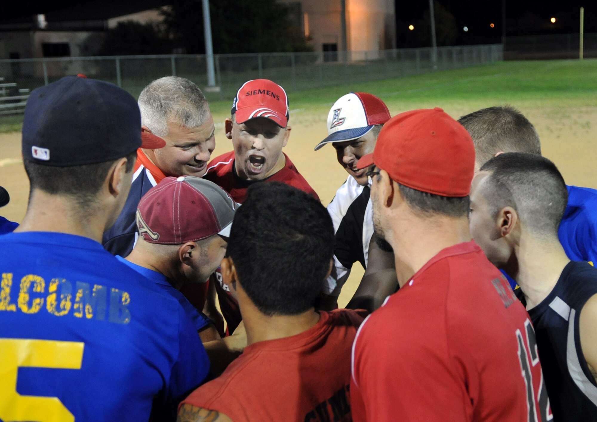 Mike Small, 436th Aircraft Maintenance Squadron, speaks to the team after winning the base softball championship Sept. 4, 2013, at the softball field on Dover Air Force Base, Del. The 436th AMXS defeated the 373rd Training Squadron/Maintenance Operations Squadron to win the title. (U.S. Air Force photo/Staff Sgt. Elizabeth Morris)