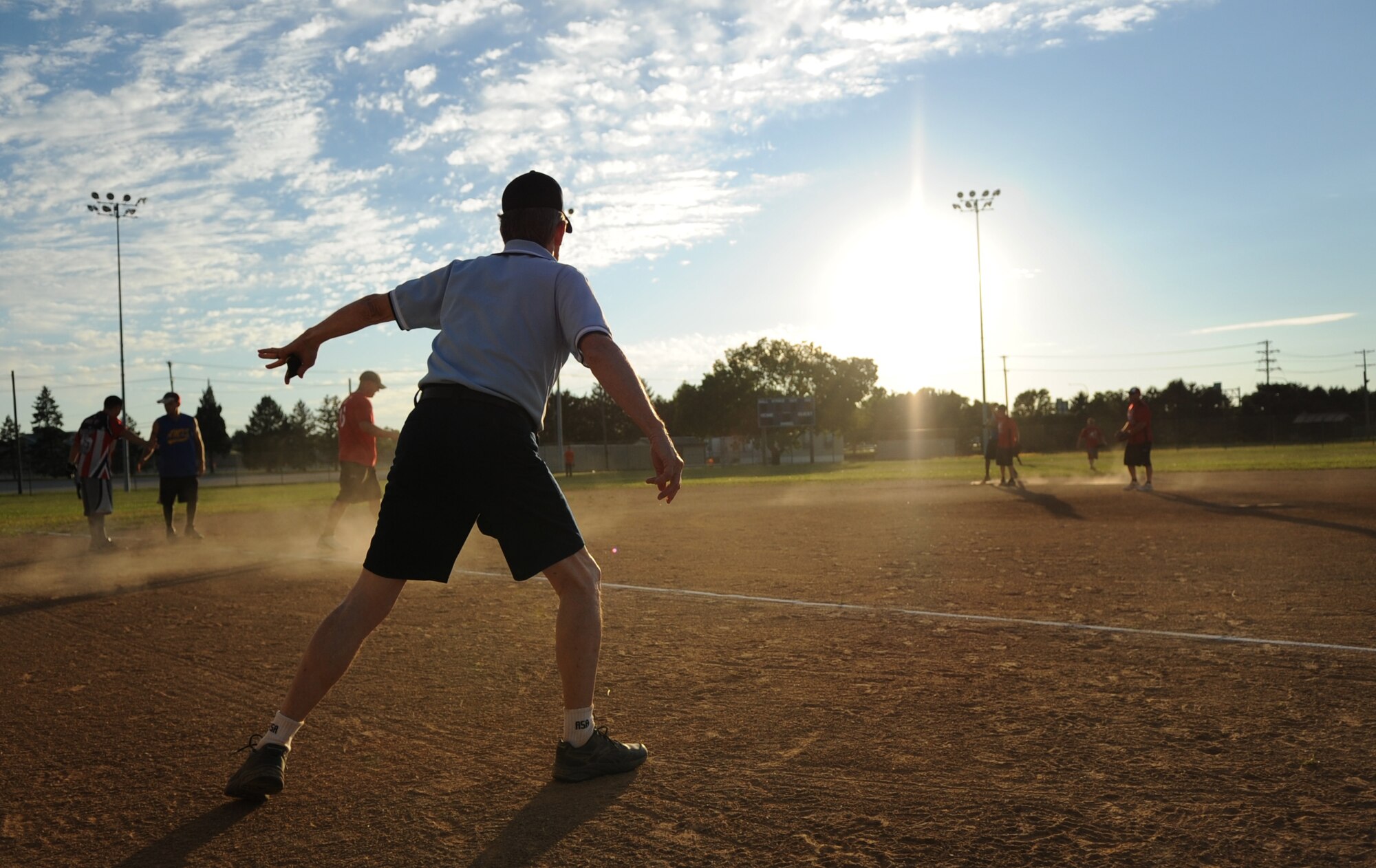 John Darcey, umpire, watches the action during the base softball championship Sept. 4, 2013, at the softball field on Dover Air Force Base, Del. Darcey has been umpiring and refereeing sports on Dover AFB since the early 1990’s. (U.S. Air Force photo/Staff Sgt. Elizabeth Morris)