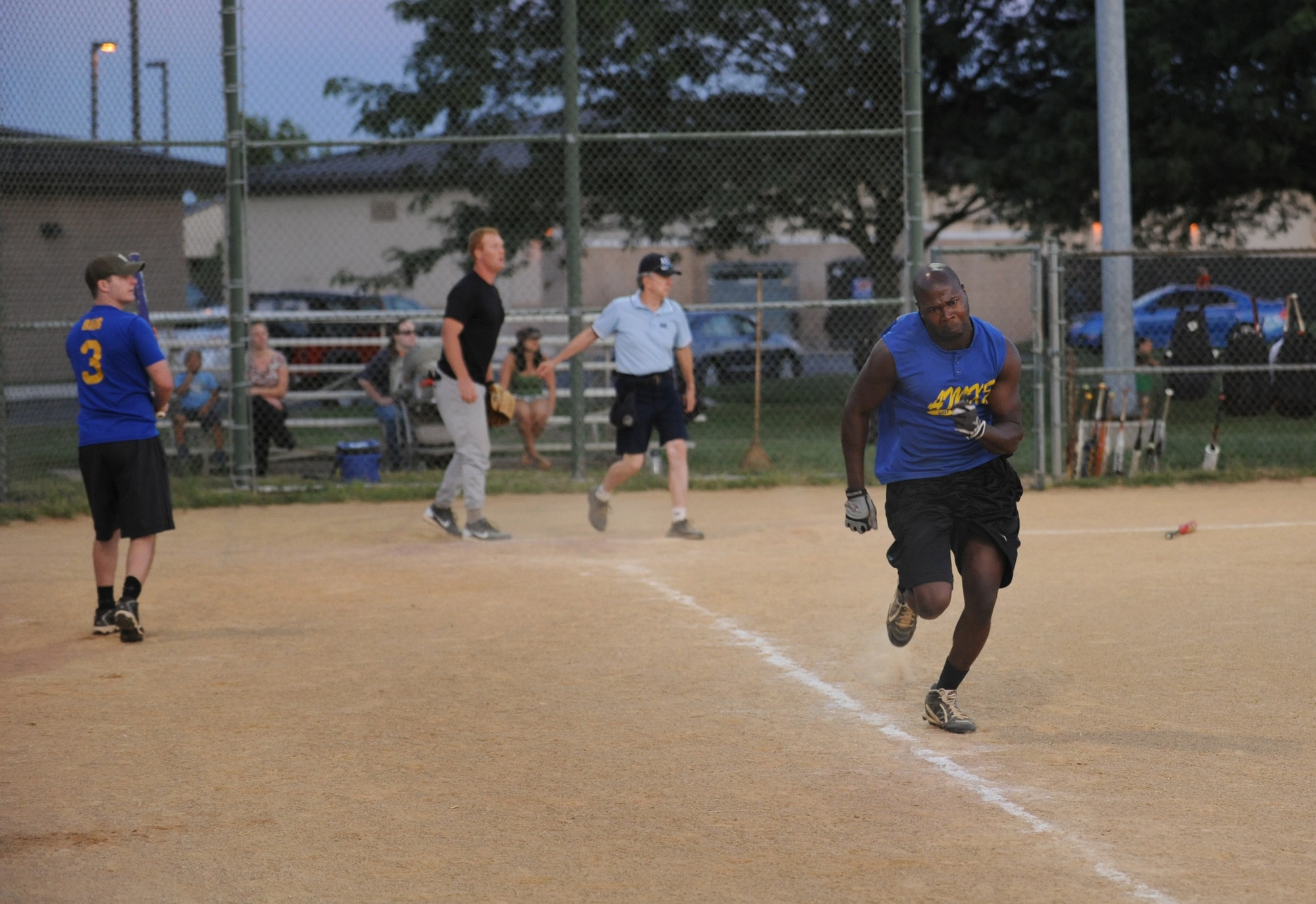 Kenneth Armstrong, 436th Aircraft Maintenance Squadron, runs to first base after hitting a single during the base championship game Sept. 4, 2013, at the softball field on Dover Air Force Base, Del. The 436th AMXS defeated the 373rd Training Squadron/Maintenance Operations Squadron to win the title. (U.S. Air Force photo/Staff Sgt. Elizabeth Morris)
