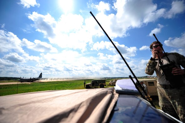 Senior Airman Chase Litvan, a U.S. Air Force combat controller from the 21st Special Tactics Squadron, Fort Bragg, N.C. conducts air traffic control operations on the edge of the Geronimo Landing Zone at Fort Polk, La. during Joint Readiness Training Center rotation 13-09, Aug. 20, 2013. Combat controllers are special operations forces and certified FAA air traffic controllers whose mission is to deploy, undetected, into combat and hostile environments to establish assault zones or airfields, while simultaneously conducting air traffic control, fire support, command and control, direct action, counter-terrorism, foreign internal defense, humanitarian assistance, and special reconnaissance. (U.S. Air Force photo/Tech. Sgt. Parker Gyokeres)
