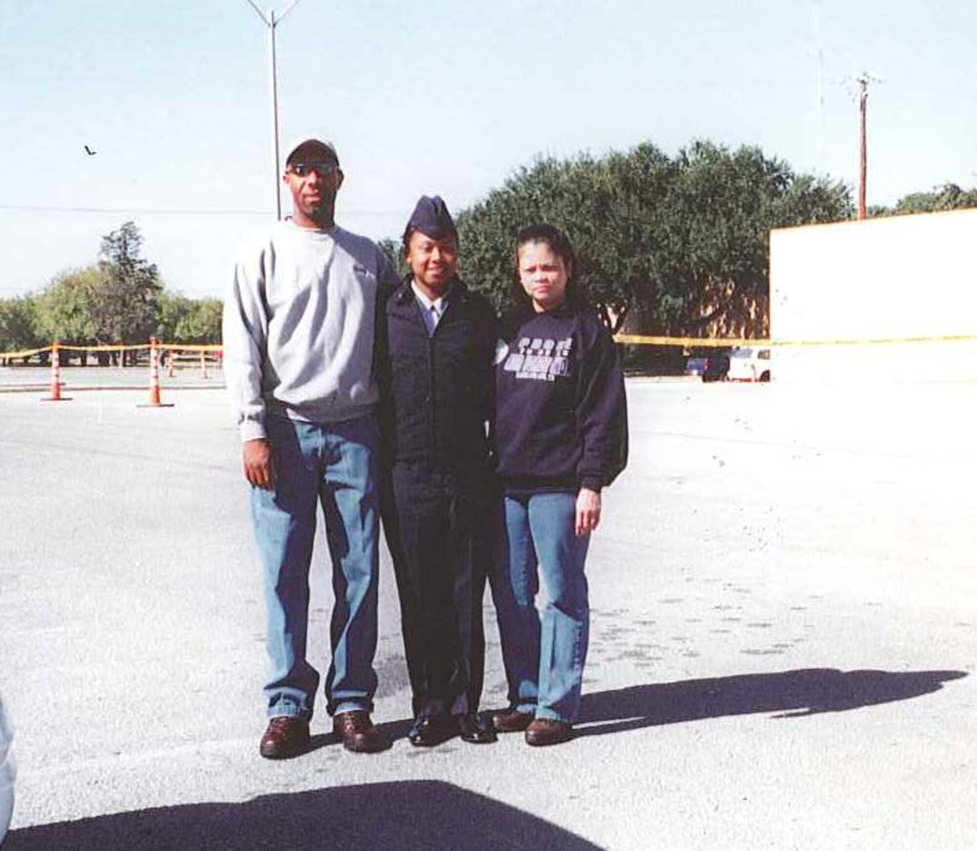 Airman Ashli Betts (center) greets her mom, Nancy Rivers, and step-dad, Tony Rivers, after she graduates from Basic Military Training in late 2001. Betts shipped to BMT Sept. 12, 2001. (Courtesy photo)