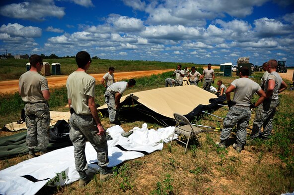 Airmen assigned to the 621st Contingency Response Wing, Travis Air Force Base, Calif., tear down their air mobility forward support base at the edge of the Geronimo Landing Zone at Fort Polk, La., at the end of their Joint Readiness Training Center rotation 13-09, Aug. 24, 2013. The CRW specializes in rapidly establishing air mobility support operations in disaster-stricken, austere or hostile environments in response to natural disasters or combat operations. (U.S. Air Force photo/Tech. Sgt. Parker Gyokeres)