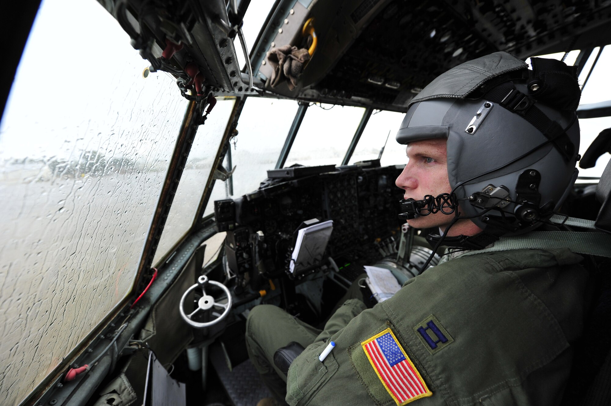 ALEXANDRIA, La. – U.S. Air Force Captain Kenneth Pedersen, a C-130H Hercules pilot assigned to the 61st Airlift Squadron, 19th Airlift Wing at Little Rock Air Force Base Ark., waits for a storm to pass at Alexandria International Airport, Alexandria, La. during Joint Readiness Training Center rotation 13-09, Aug. 21, 2013. The aircraft was conducting coalition airlift operations with the Royal New Zealand Air Force and the Canadian Royal Air Force at Fort Polk in support of the 82nd Airborne Division. (U.S. Air Force photo by Tech. Sgt. Parker Gyokeres)(Released)
