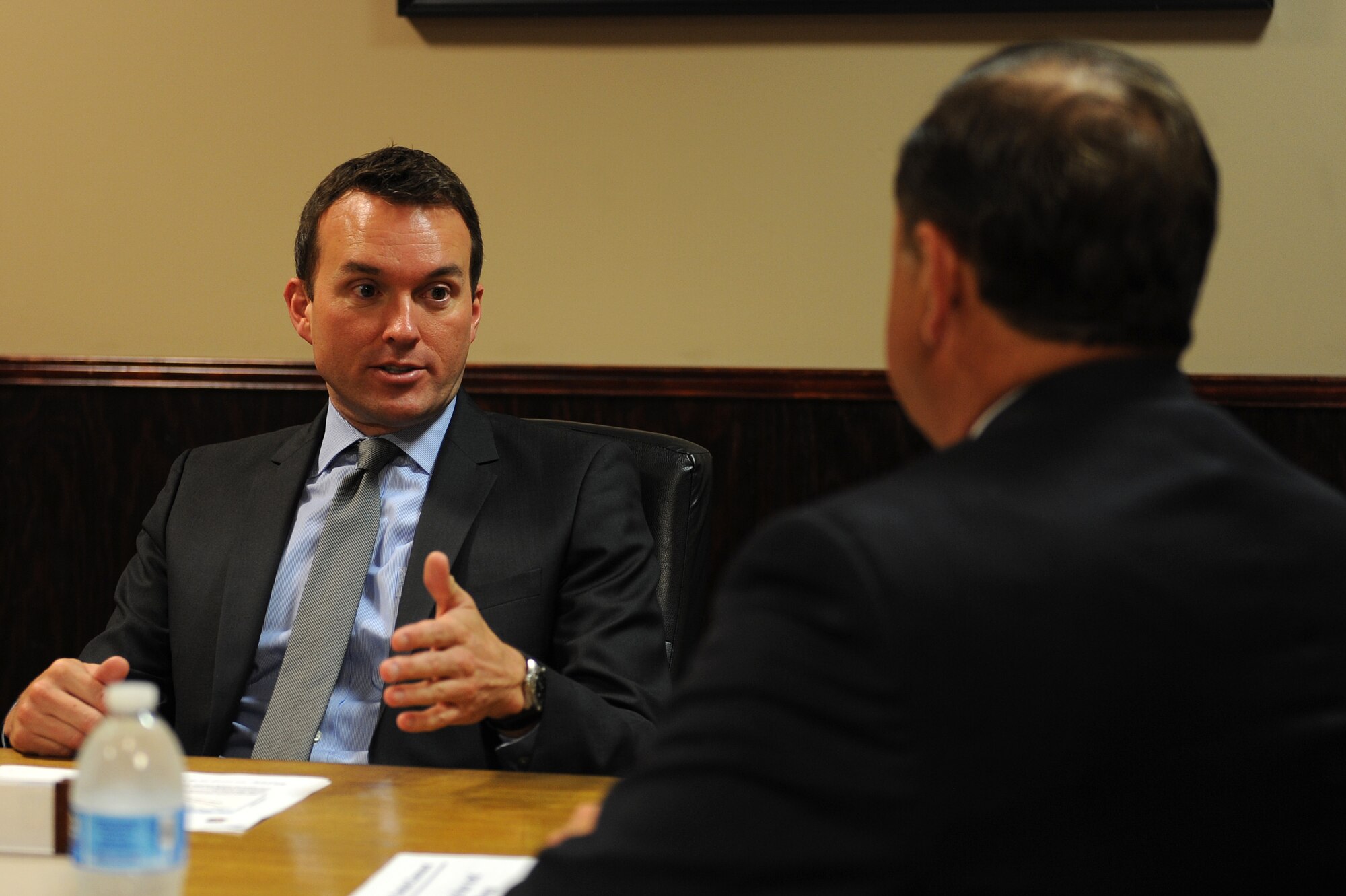 Acting Secretary of the Air Force Eric Fanning discusses the flying hour program with James Dunn, Air Combat Command air and space operations director, during a visit to Langley Air Force Base, Va., Sep. 5, 2013. Fanning toured the 94th Fighter Squadron, the 497th Intelligence, Surveillance and Reconnaissance Wing and the Air Force Targeting Center. Additionally, Fanning spoke to Langley Airmen about current Air Force issues, including sequestration, sexual assault prevention and force shaping. (U.S. Air Force photo by Senior Airman Brittany Paerschke-O’Brien/Released)