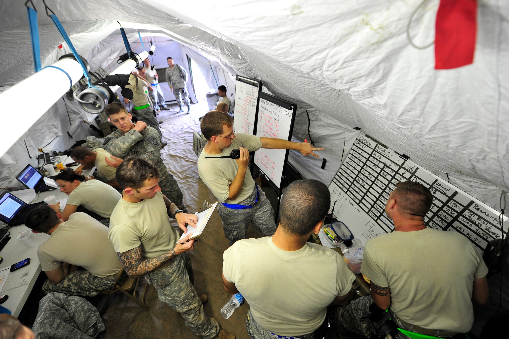 ALEXANDRIA, La. – U.S. Air Force Airmen assigned to the 621st Contingency Response Wing, Joint Base McGuire-Dix-Lakehurst, N.J., and U.S. Army Soldiers from the 82nd Airborne Division, Fort Bragg, N.C., coordinate cargo handling, inspection and aircraft loading operations at Alexandria International Airport, Alexandria, La. during Joint Readiness Training Center rotation 13-09, Aug. 19, 2013. JRTC scenarios allow complete integration of Air Force and other military services as well as host-nation and civilian role players.  (U.S. Air Force photo by Tech. Sgt. Parker Gyokeres)(Released)