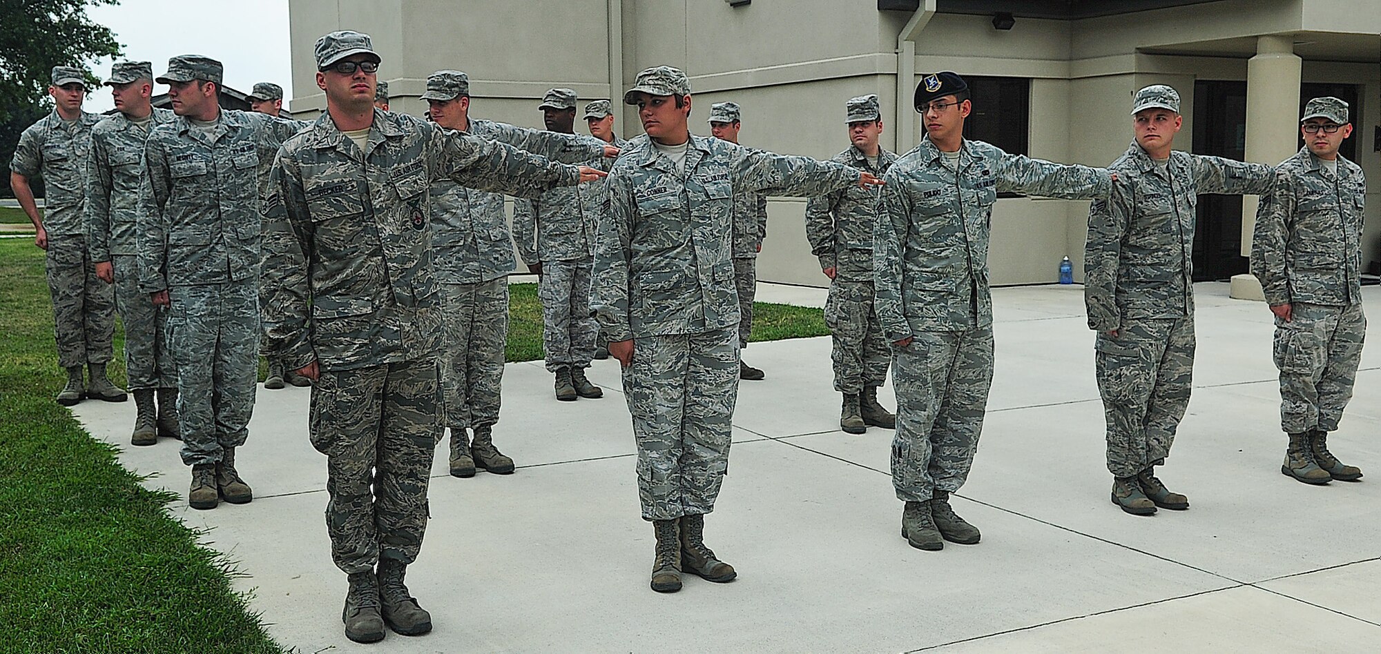 Students practice forming up for an open ranks inspection while attending Airman Leadership School Aug. 28, 2013, at the ALS building on Dover Air Force Base, Del.  Open rank inspections are one of the activities students learn during their time at ALS. (U.S. Air Force photo/Airman 1st Class Ashlin Federick)