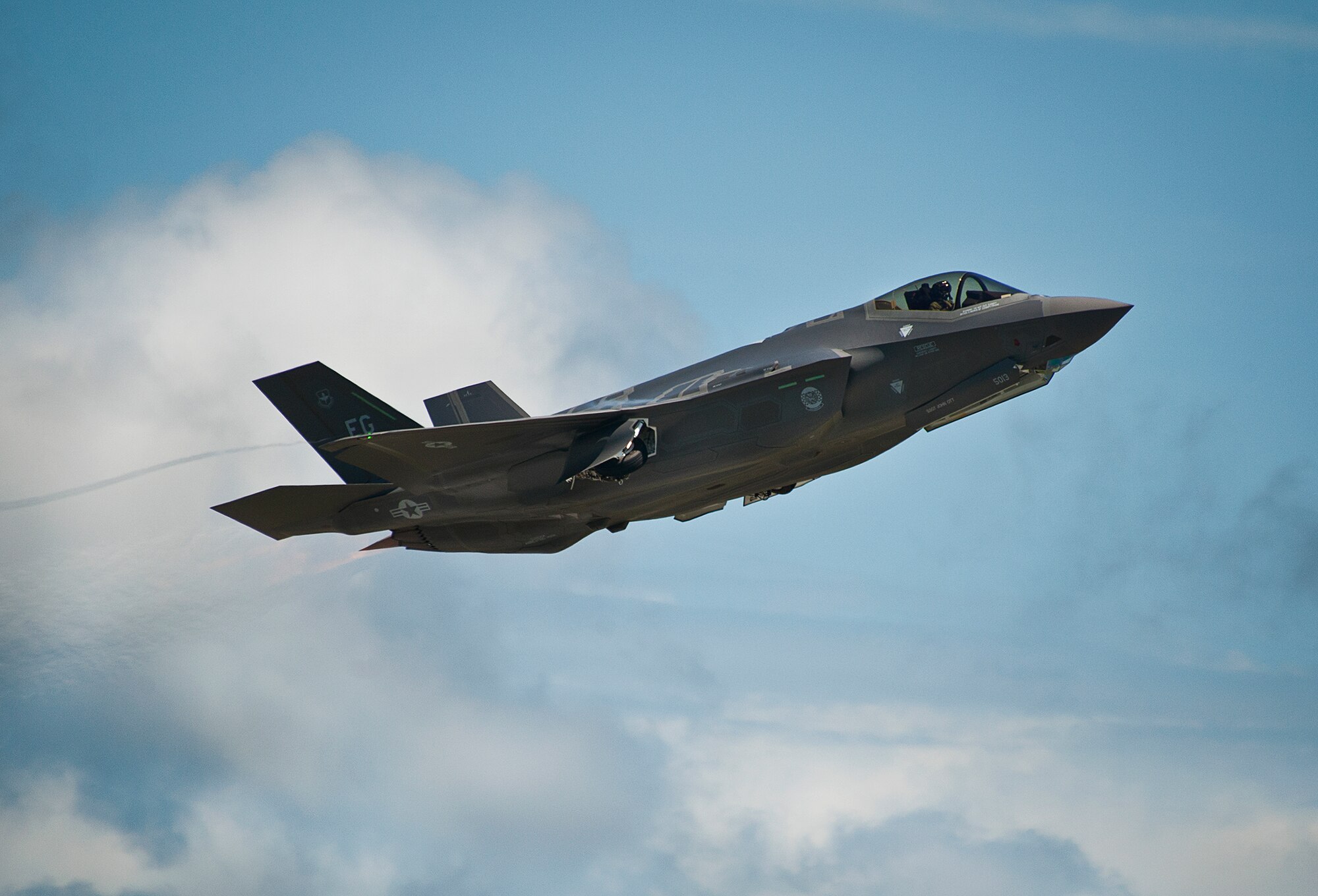 An F-35A Lightning II takes off from the Eglin Air Force Base runway after a hot pit refuel.  Airmen, Marines and Sailors are refueling their F-35 variants for multiple sorties via 96th Test Wing fuel trucks while construction is completed on the 33rd’s hot pit area.  (U.S. Air Force photo/Samuel King Jr.)