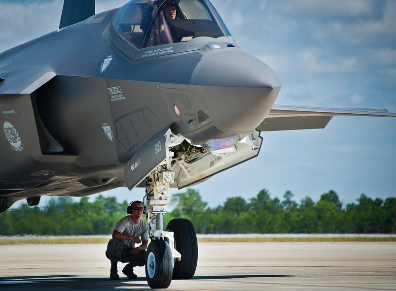 A maintainer from the 33rd Aircraft Maintenance Squadron, monitors preflight checks on an F-35A Lightning II after a hot pit session on the 33rd Fighter Wing flightline at Eglin Air Force Base, Fla.  Airmen, Marines and Sailors are refueling their F-35 variants for multiple sorties via 96th Test Wing fuel trucks while construction is completed on the 33rd’s hot pit area.  (U.S. Air Force photo/Samuel King Jr.)