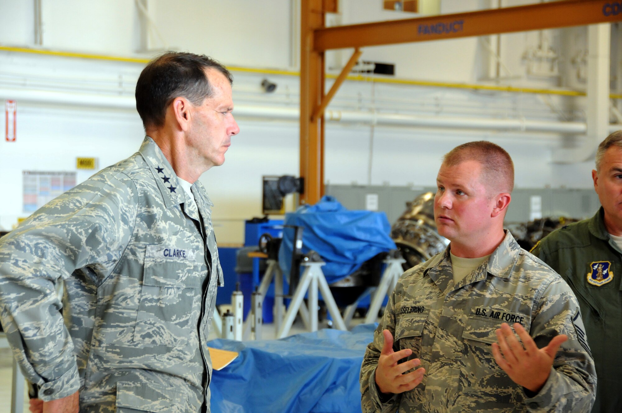 ABRAHAM LINCOLN CAPITAL AIRPORT, Illinois -- Master Sgt. Carl Hasselbring, 183d Maintenance Squadron, briefs Lt. Gen. Stanley Clarke, Director, Air National Guard, on the mission of the 183d Fighter Wing's jet engine Centraized repair Facility (CRF), a new mission at the unit. (Air National Guard photo by Master Sgt Shaun Kerr/Released)