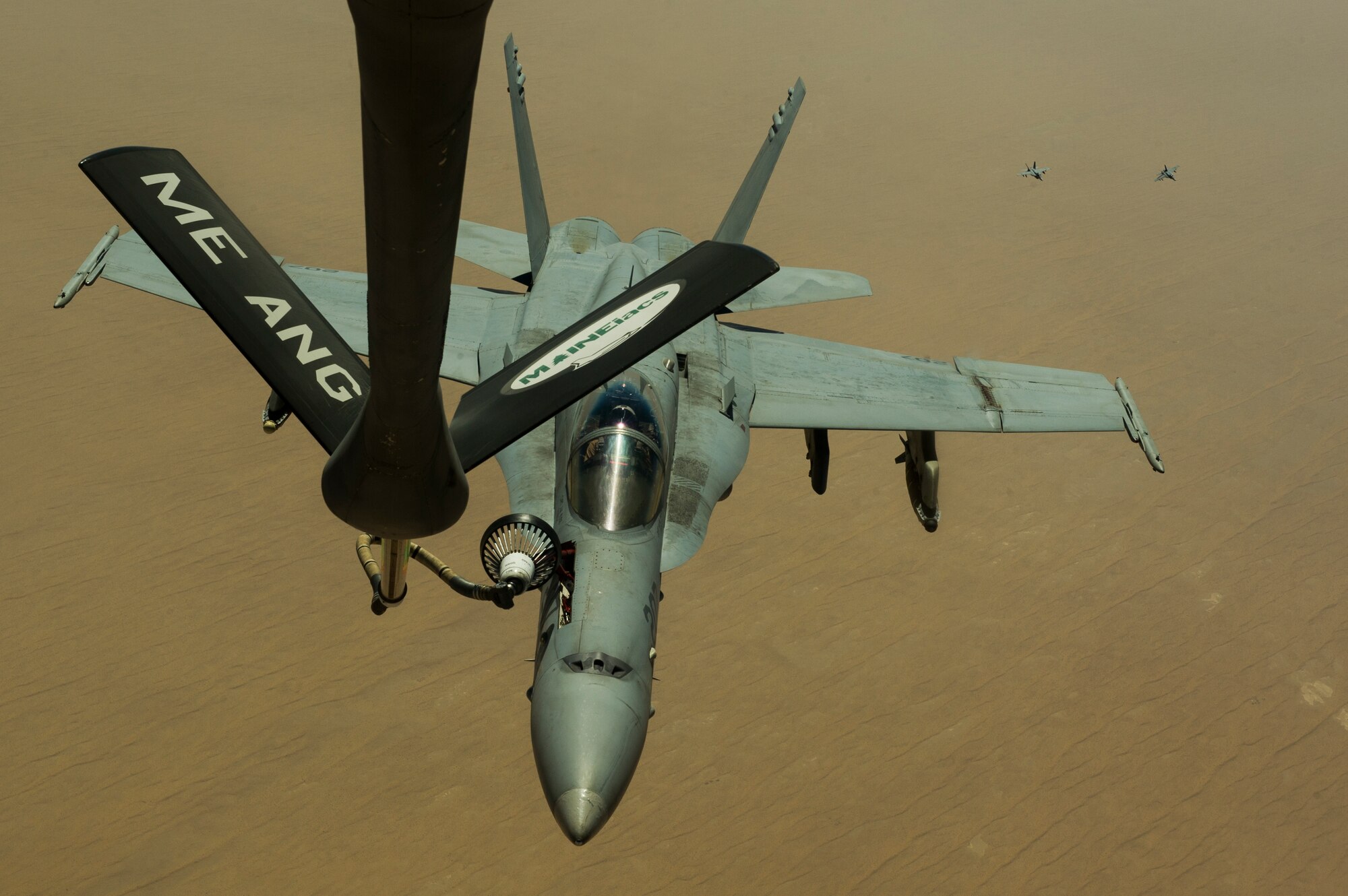 A U.S. Navy F/A-18C Hornet receives fuel from a 340th Expeditionary Air Refueling Squadron KC-135 Stratotanker Sept. 4, 2013, over Afghanistan. The Hornet, based on aircraft carrier USS Harry Truman (CVN 68), deploy in support of Operation Enduring Freedom. (U.S. Air Force photo by SSgt Stephany Richards)
