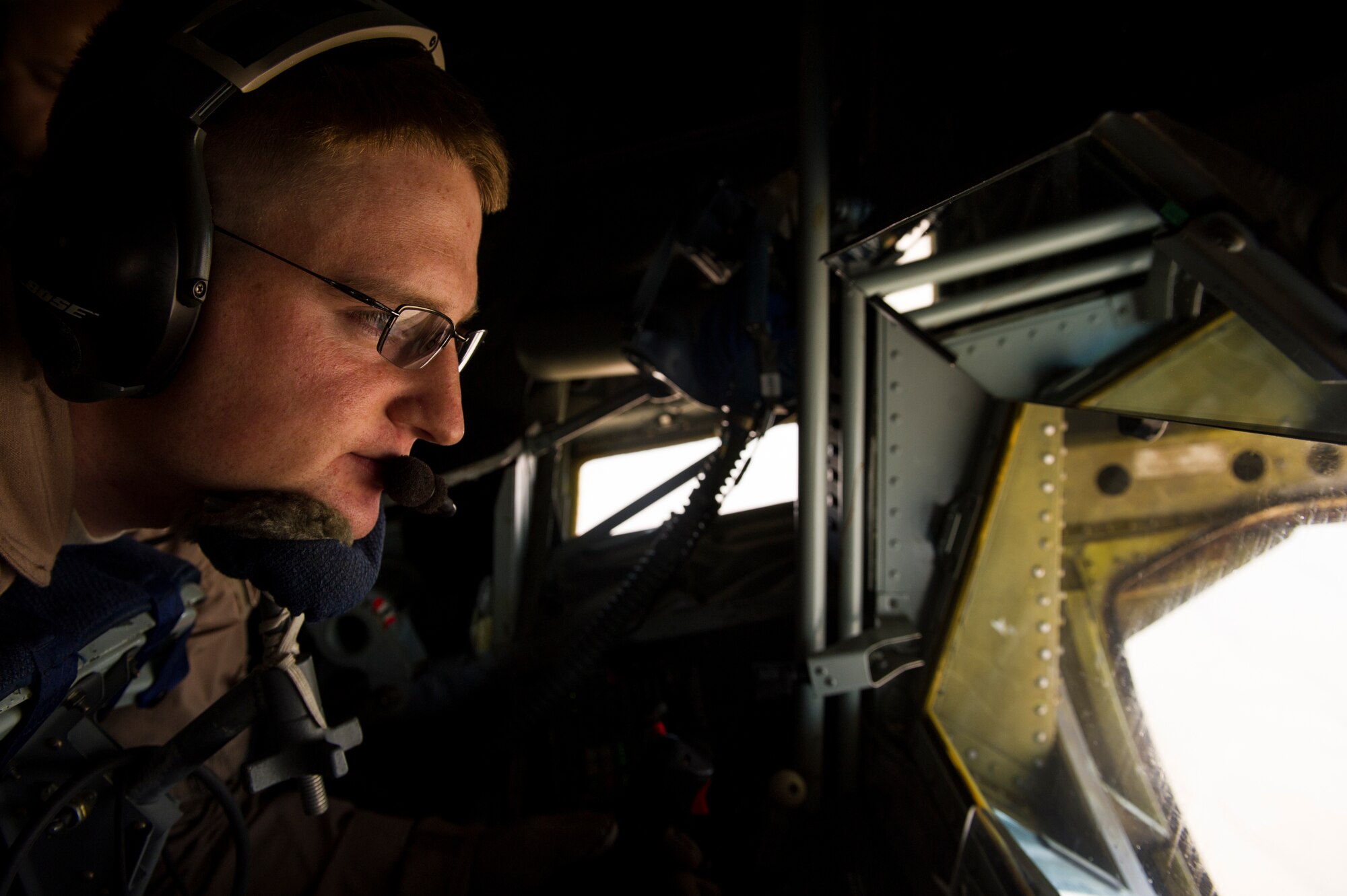 U.S. Air Force Staff Sgt. Daniel King, 340th Expeditionary Air Refueling Squadron KC-135 Stratotanker boom operator, operates the boom during an air refueling mission over Afghanistan Sept. 4, 2013. King is deployed from the 756th Air Refueling Squadron, at Andrews Air Force Base in support of Operation Enduring Freedom. (U.S. Air Force photo by SSgt Stephany Richards)

