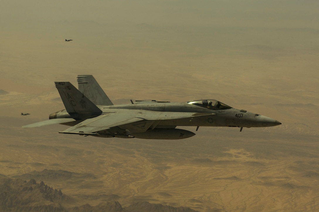 An U.S. Navy F/A-18E Hornet receives fuel from a 340th Expeditionary Air Refueling Squadron KC-135 Stratotanker Sept. 4, 2013, over Afghanistan. The Hornets, based on aircraft carrier USS Harry Truman (CVN 68), deploy in support of Operation Enduring Freedom. (U.S. Air Force photo by SSgt Stephany Richards)
