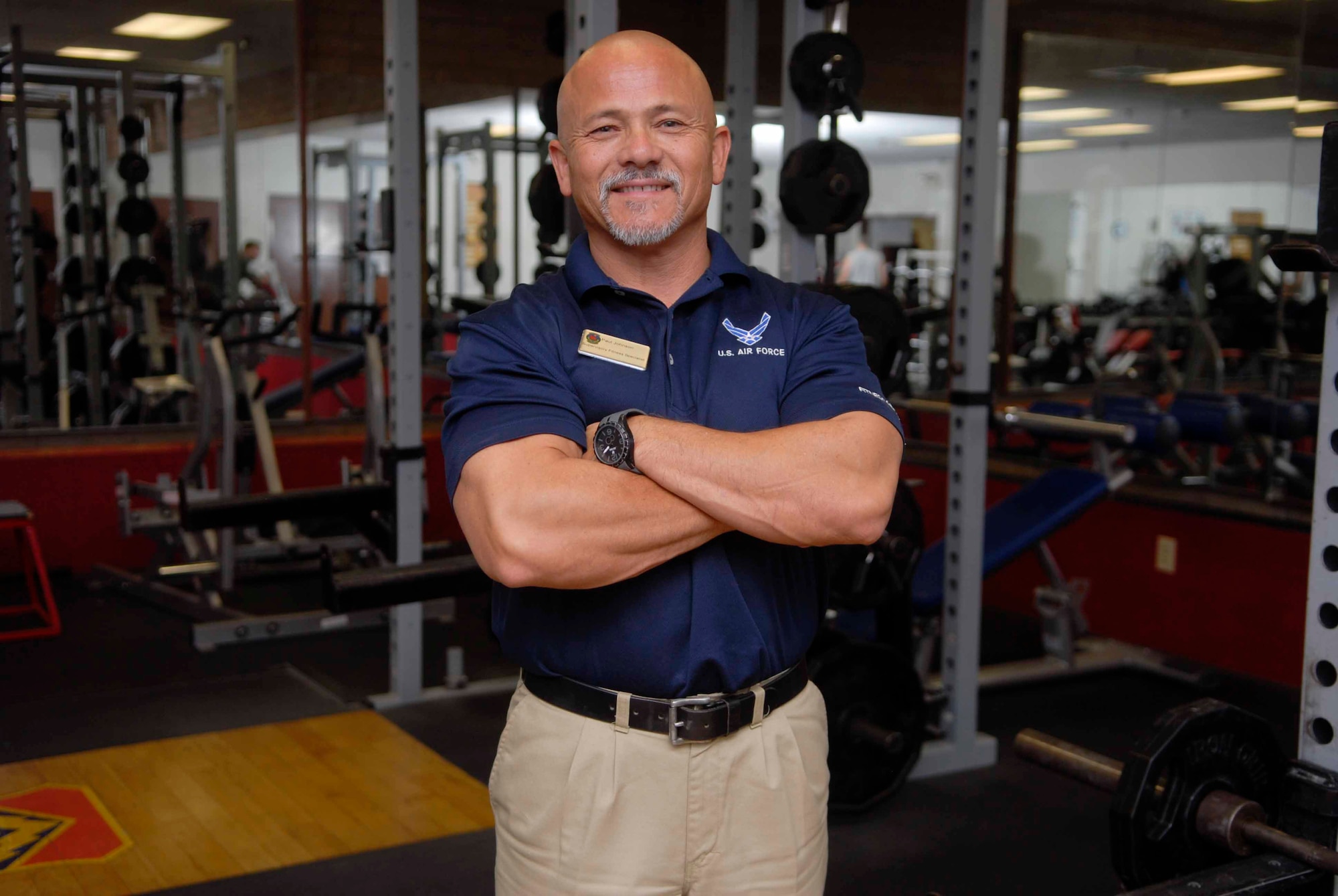 Paul Johnson, 56th Force Support Squadron Bryant Fitness Center fitness specialist supervisor, poses for a photo Aug. 21 in the weight room at the Luke Air Force Base Bryant Fitness Center. Johnson is a survivor of multiple accidents, one of which changed his life forever, spurring him to become a personal trainer. 