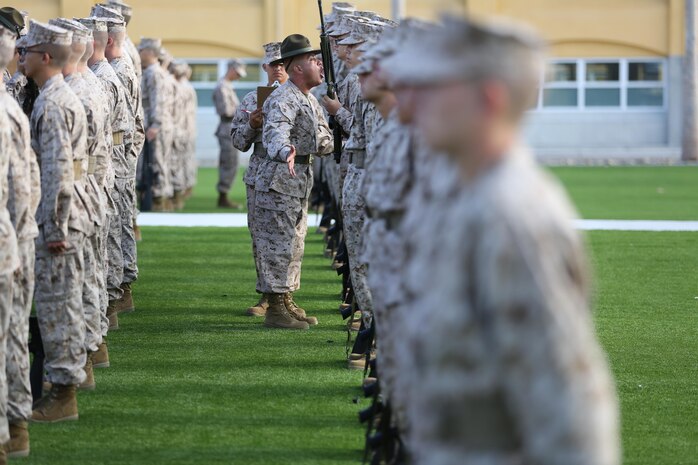 Recruits of Company F, 2nd Recruit Training Battalion, wait as drill instructors make their way down the rows during the senior drill instructor inspection aboard Marine Corps Recruit Depot San Diego, Aug. 23.  The purpose of the inspection is to provide drill instructors an opportunity to test recruits in multiple areas, to include their uniforms.
