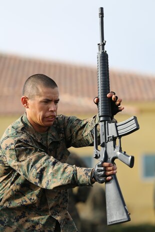 Recruit Jesse Arreiiano, Platoon 3271, Company M, 3rd Recruit Training Battalion, performs a left block during the Marine Corps Martial Arts Program test aboard Marine Corps Recruit Depot San Diego, Aug. 21.  The purpose of the MCMAP test is to ensure recruits retain the martial arts training they have received over the course of recruit training.