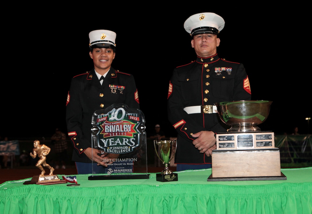 Aaron Hiedman, a player with the Basic High School Wolves, is awarded the Student Athlete Award before the game against Green Valley High School in Henderson, NV., Sept. 7, 2013. Sgt. Billy Carroll, a Marine recruiter with Recruiting Sub-Station Las Vegas presented Heidman with the award for his contributions on and off the field.