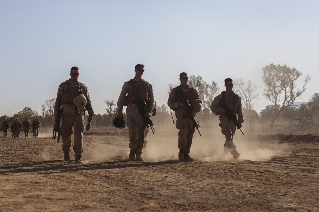 Marines with Company E., Battalion Landing Team 2nd Battalion, 4th Marines, 31st Marines Expeditionary Unit, walk back from the range following an integrated, live-fire exercise for Exercise Koolendong 13 here, Sept. 3. The 31st MEU moved a battalion-sized force more than 300 miles inland to conduct the training. The exercise demonstrates the operational reach of the 31st MEU and reinforces why the 31st MEU is the force of choice for the Asia-Pacific region. Also participating in the exercise is the Marine Rotational Force – Darwin and soldiers of the 5th Royal Australian Army. The 31st MEU brings what it needs to sustain itself to accomplish the mission or to pave the way for follow-on forces.